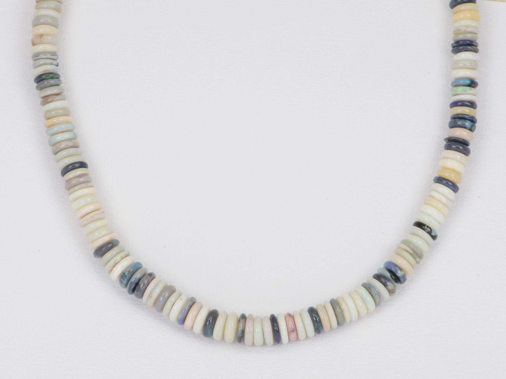 ♥ Solid Australian crystal and black Opal Heishi bead necklace with a 14k yellow gold sailor clasp
♥ The necklace measures 17