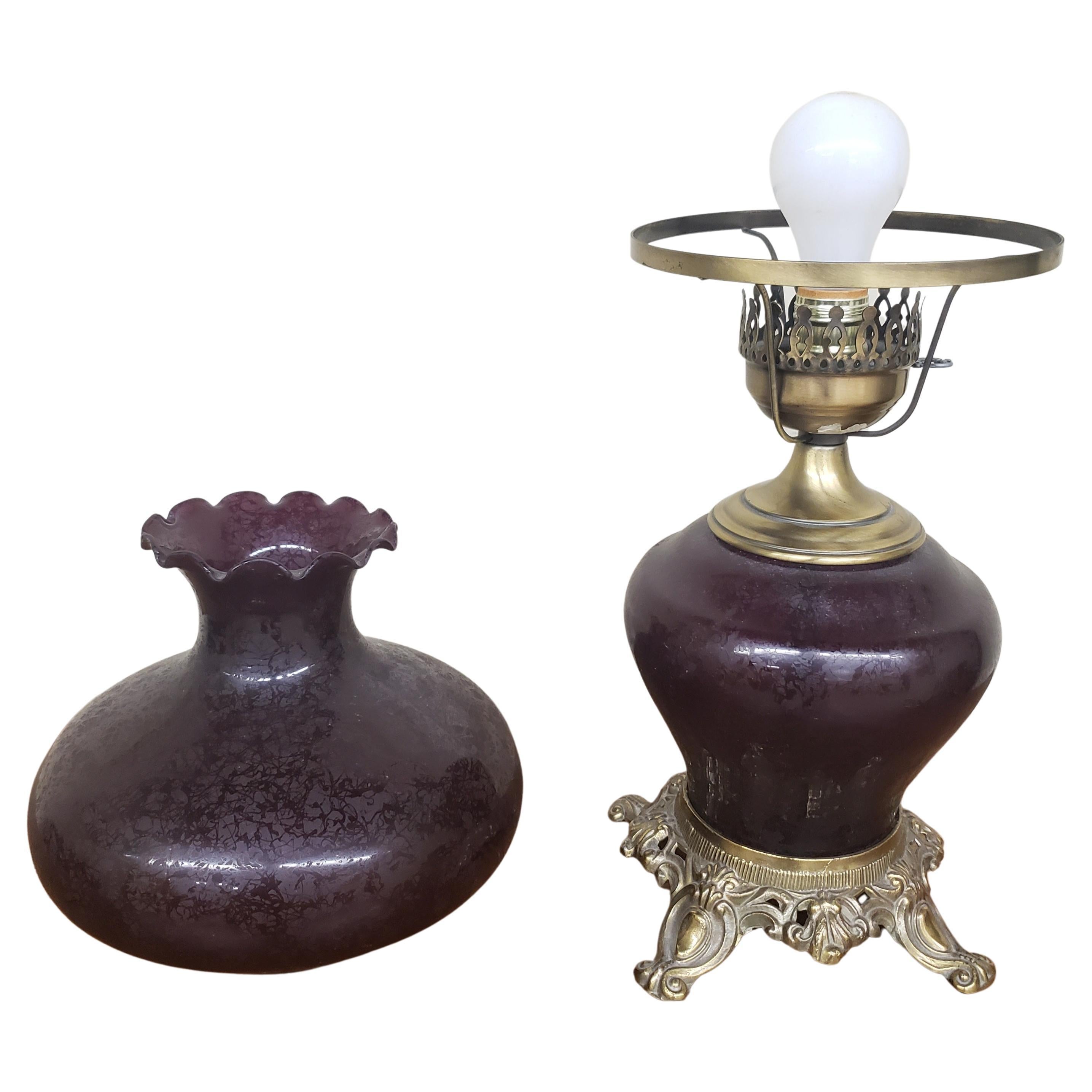 Cranberry glass Parlor lamp with solid brass base.