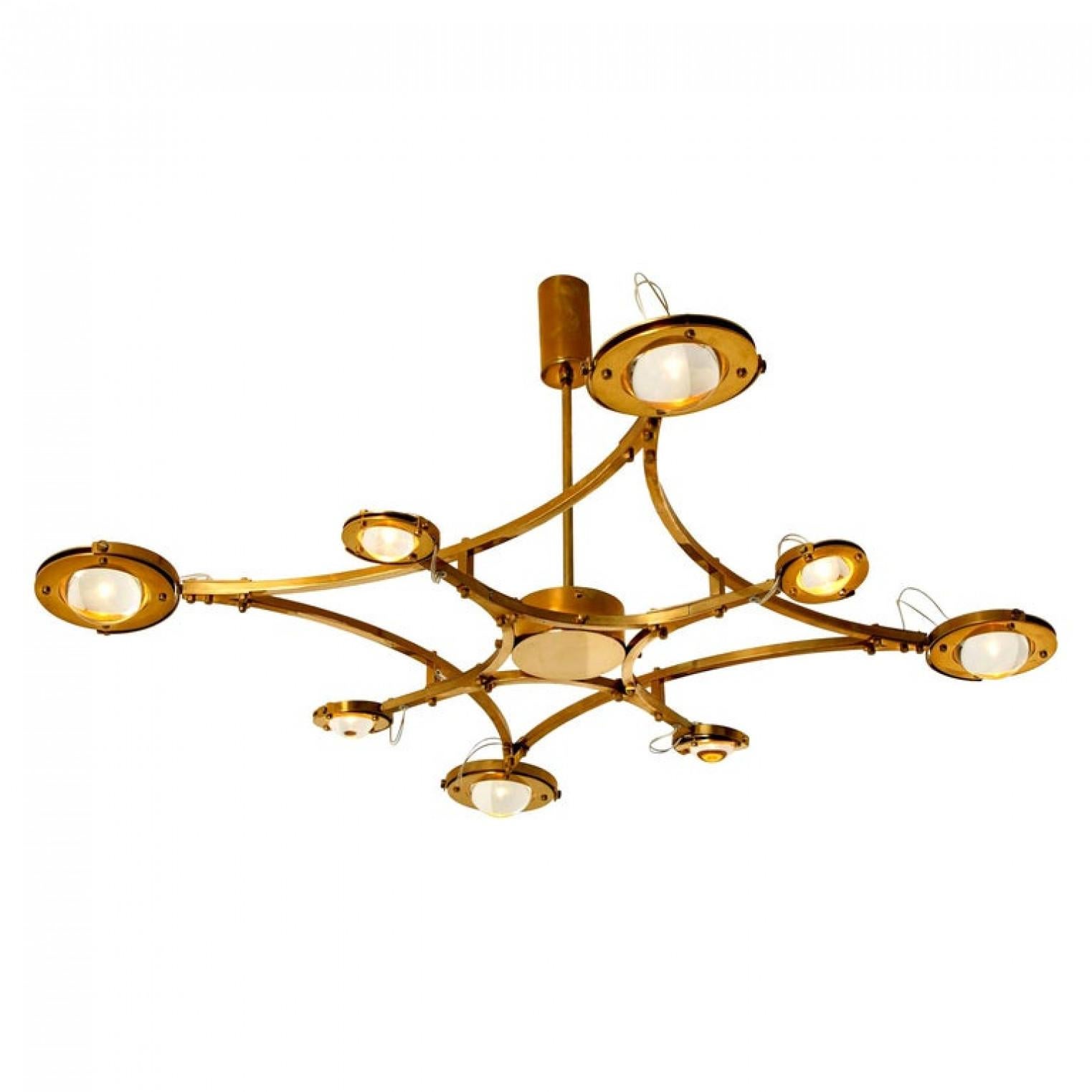 This exceptional high-end and handmade jewel lamp is made from brass. An exceptional detail on this flush mount is the lens light. Each lens is flexible and rotates freely in any direction. A stunning light partition on ceiling and room. A