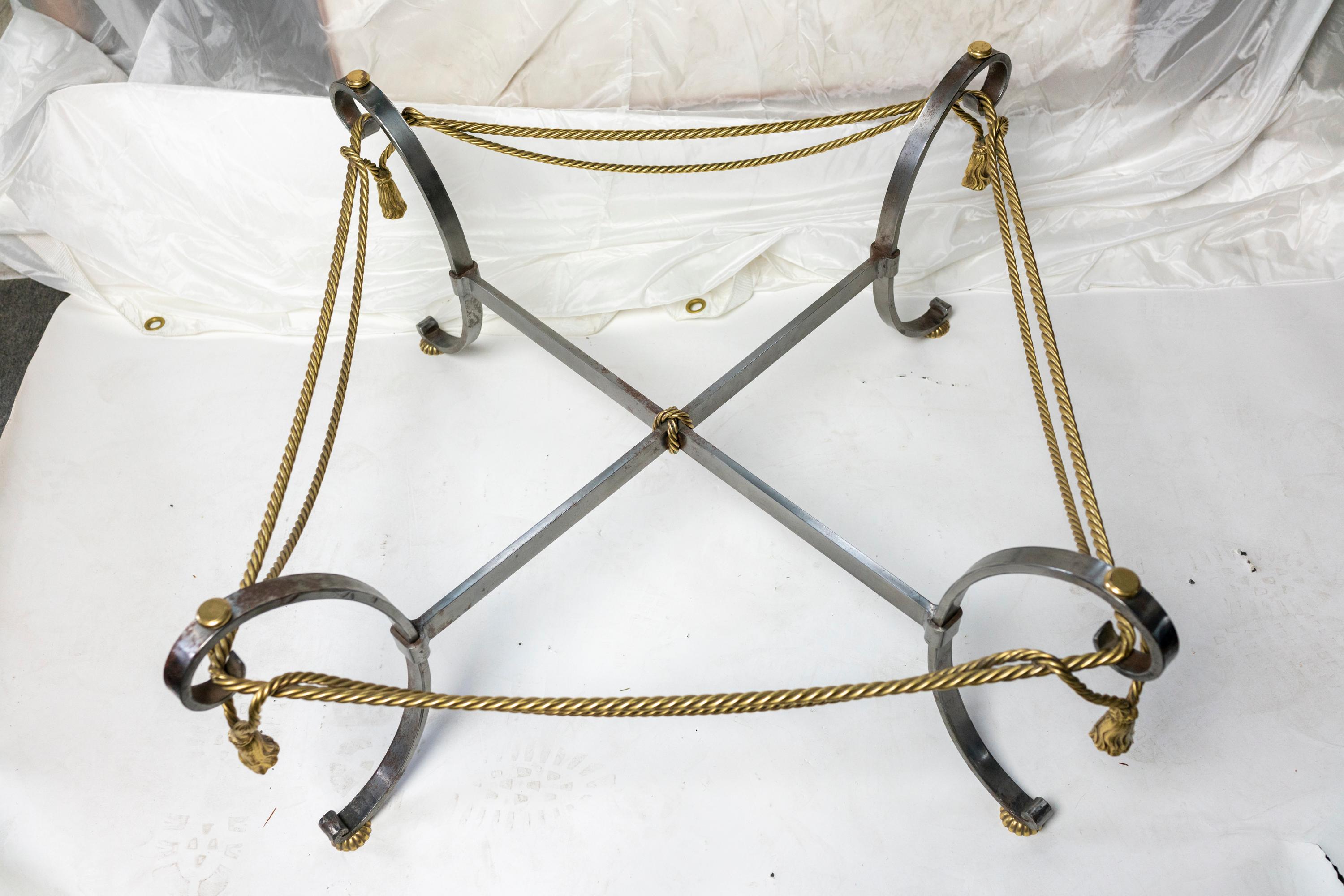 Solid brass and steel coffee table in the style of Maison Jansen with rope twist
Glass not included.