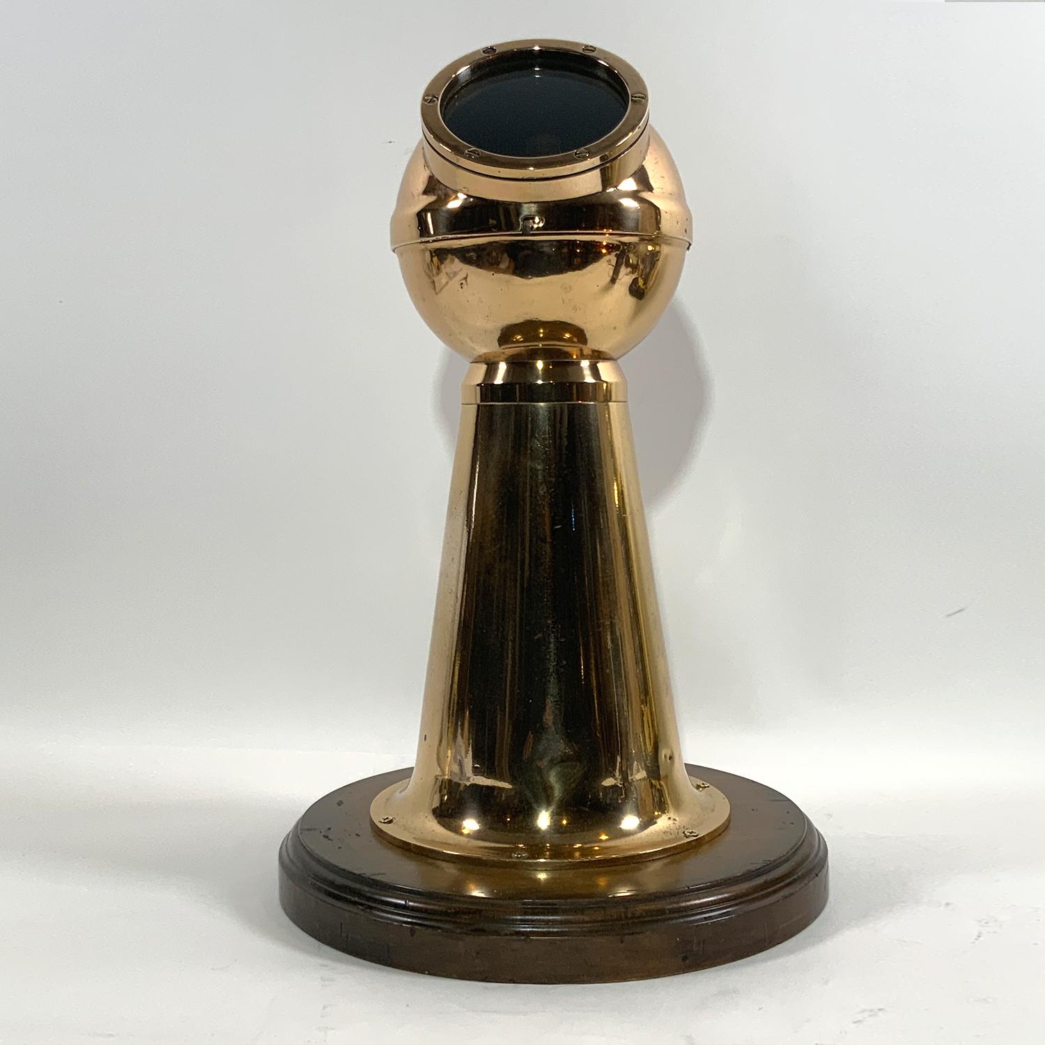 Kevin White Boston Yacht binnacle with a highly polished and lacquered pillar shape binnacle. Art deco style. Removable hood with porthole window. Fitted to a thick wood base. Circa 1930.