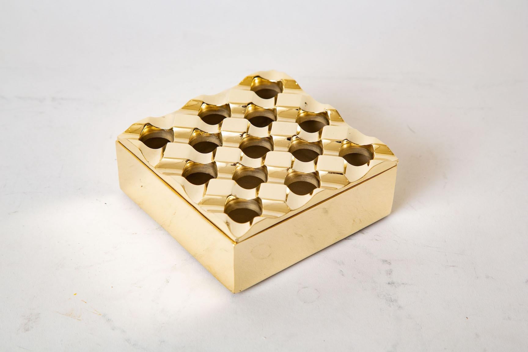 This geometric solid brass ashtray and or fabulous desk accessory for pens and pencils is designed by Backstrom Holger and Bo Ljungberg for Diverse Ting. It is from Sweden and from 1970. This square shape and great design was the earliest computer