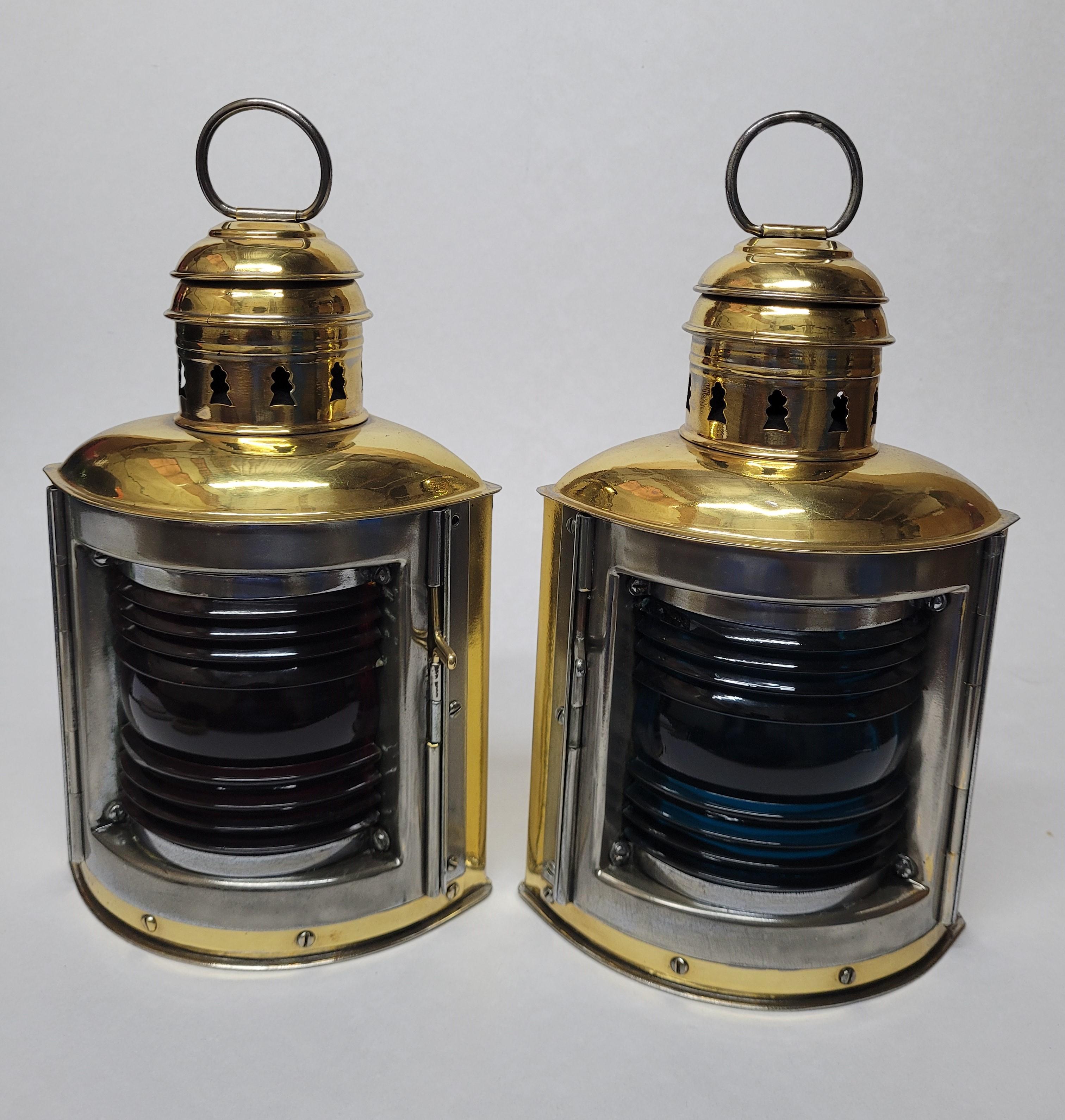 Sturdy pair of meticulously polished and laquered ships lanterns by Perko Delite. With steel framed doors, vented tops and carry rings. First class polish job. American Circa 1995.

Weight: 2.5 lbs.
Overall Dimensions: 12