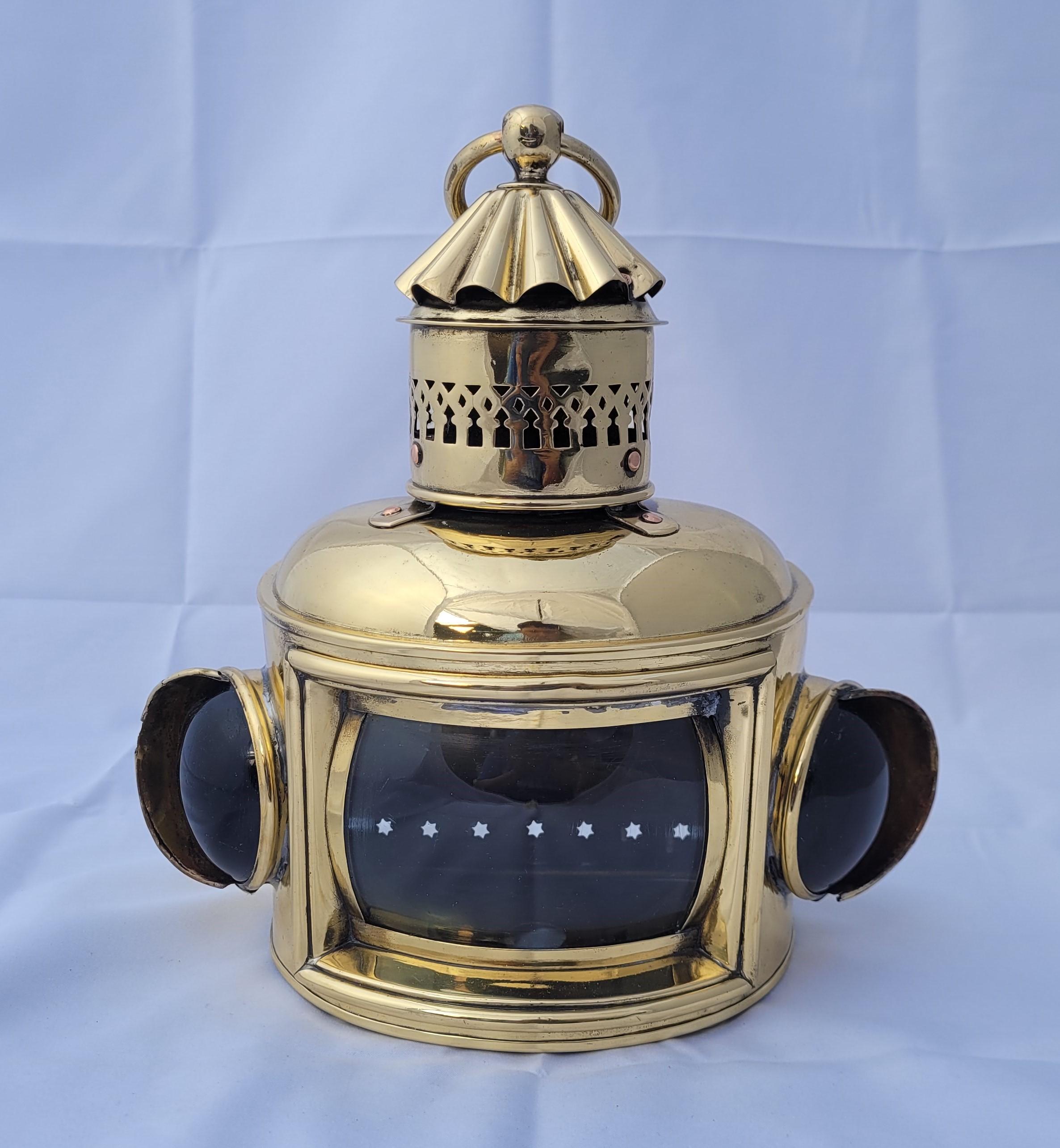 Choice antique nautical boat lantern with clear convex main lens and red and green bullseye lenses. With oil tank, burner and wick inside. Vented top with carry loop. Hinged rear door. Meticulously polished and lacquered. Fabulous antique ship