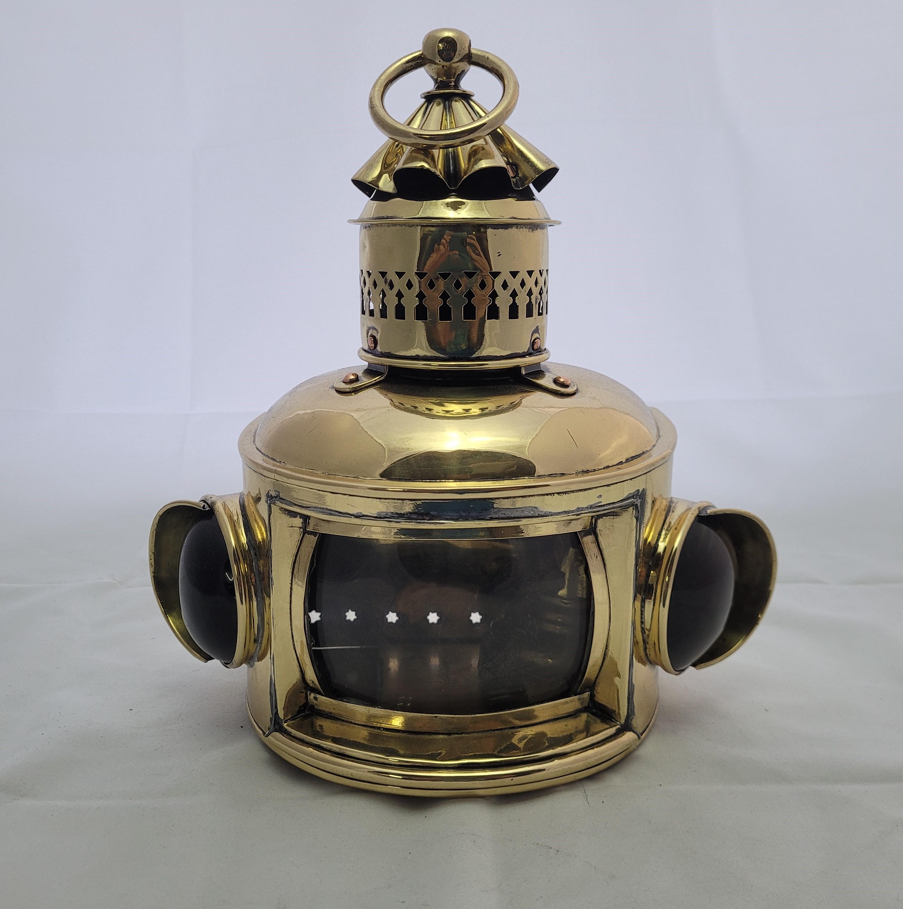 Choice antique nautical boat lantern with clear convex main lens and red and green bullsey lenses. With oil tank, burner and wick inside. Vented top with carry loop. Hinged rear door. Meticulously polished and lacquered. Fabulous antique ship