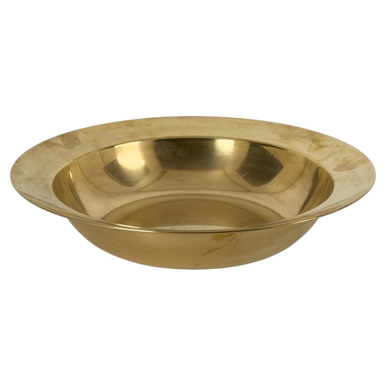 Solid brass bowl featuring a beautifully textured surface and polished interior.