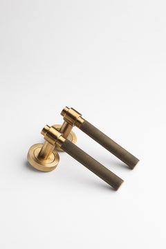 Art Deco brass lever handle in aged gold finish