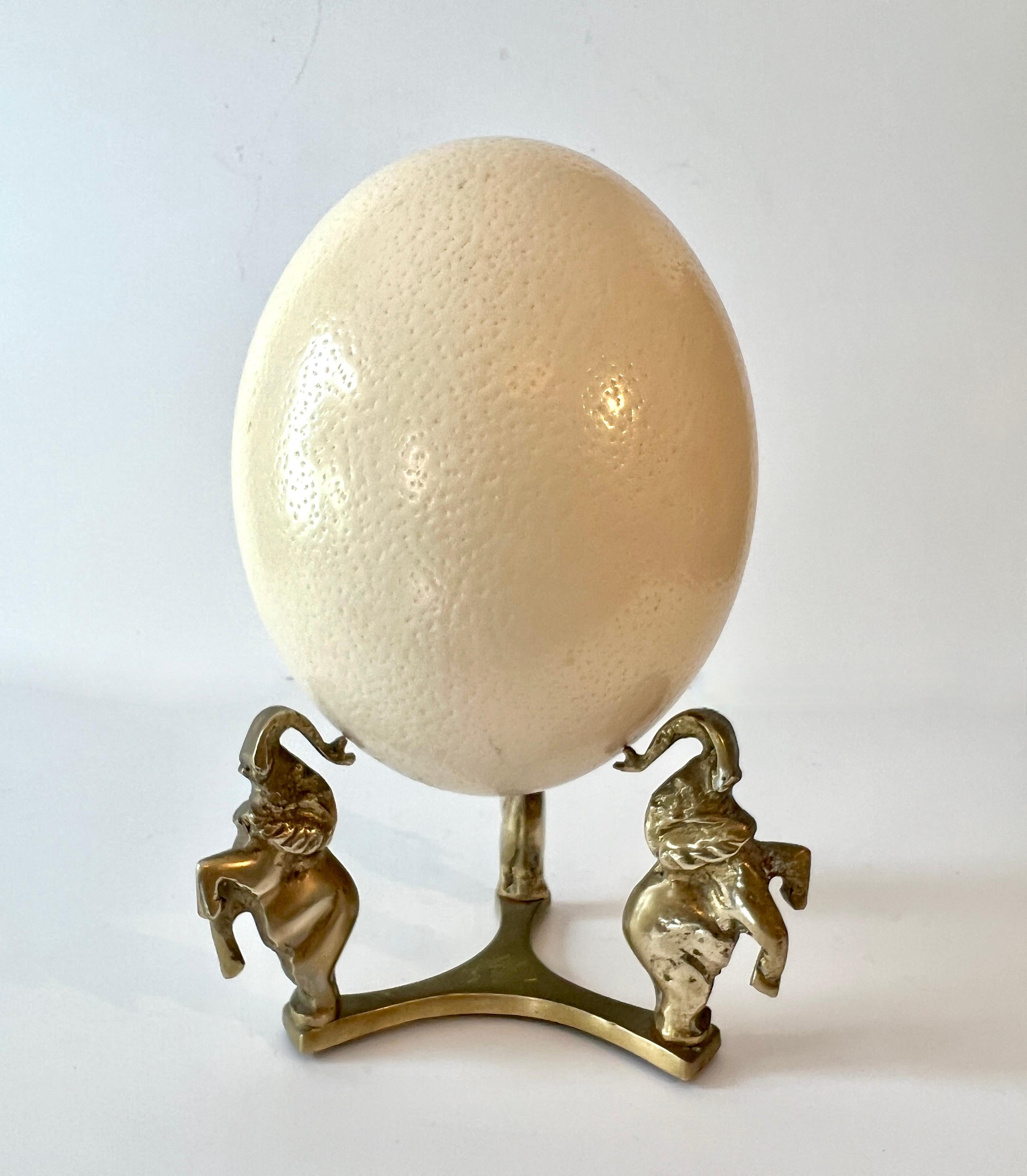 A whimsical and unique way to display an ostrich egg or a large sphere or bowl.  Thie piece comes with an Ostrich egg - it's a perfect paring.

A complement on any shelf, cocktail table and especially a child or babies room.  we will sell the pieces