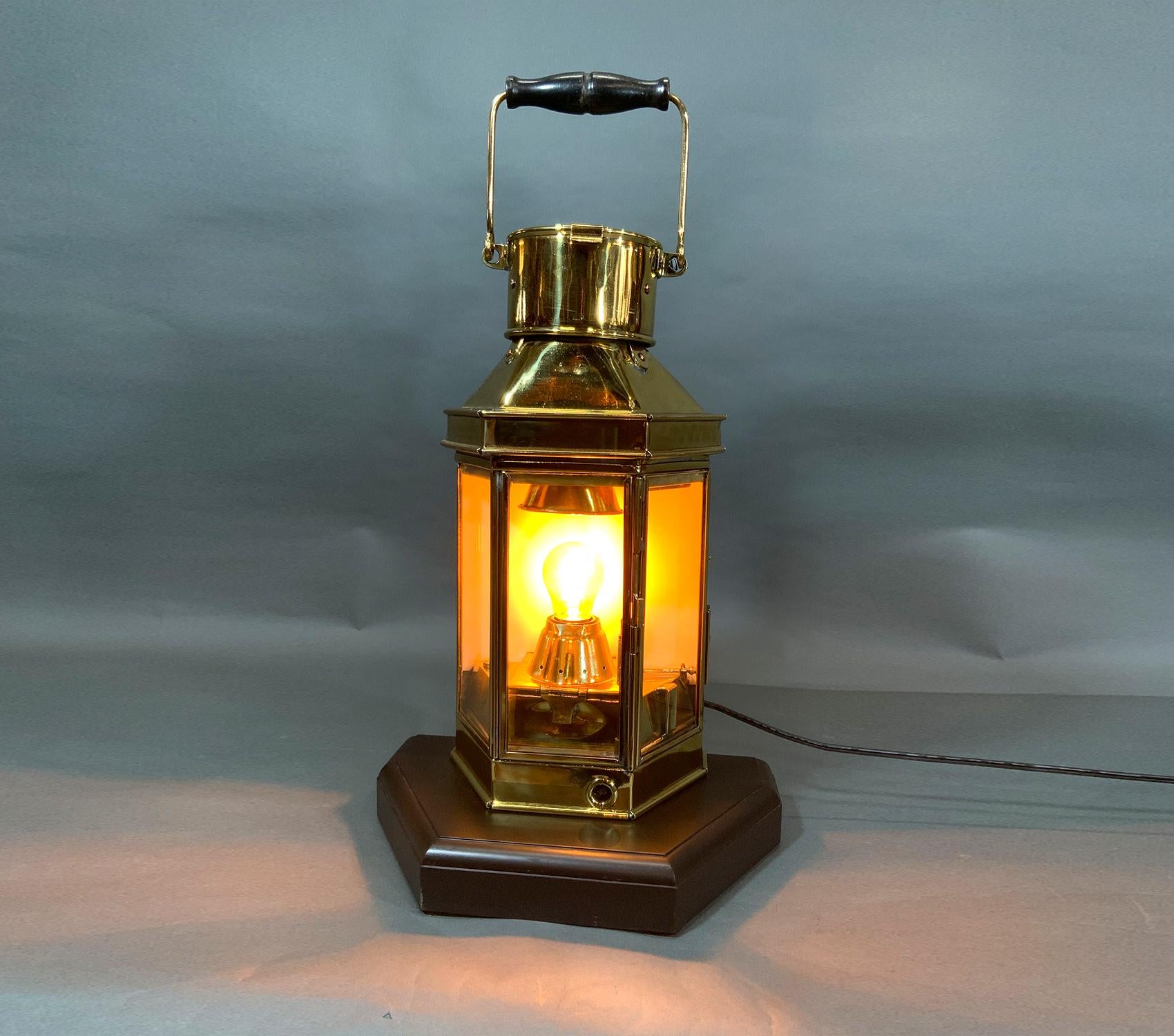 Mounted to a thick mahogany base. Fitted with a custom electric socket into the original oil burner. Choice restoration of a spectacular lantern.

Weight: 13 LBS
Overall Dimensions: 18