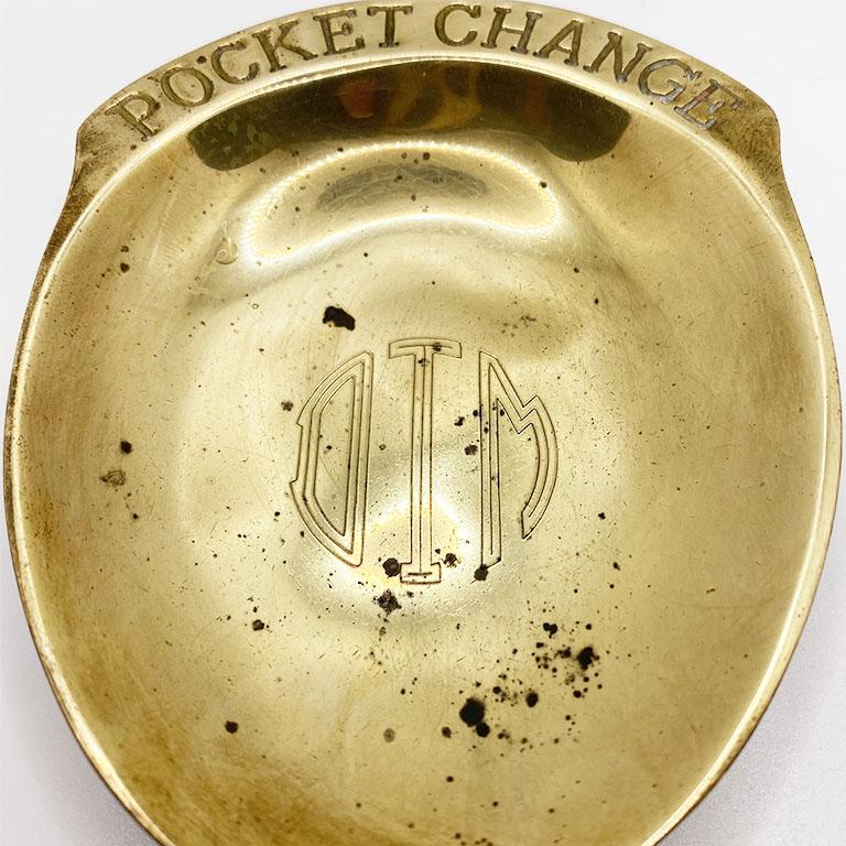 A vintage solid brass pocket change catchall or vide-poche. This mid-century style trinket dish will be a great way to store loose change on a nightstand or dressing table. Engraved with 