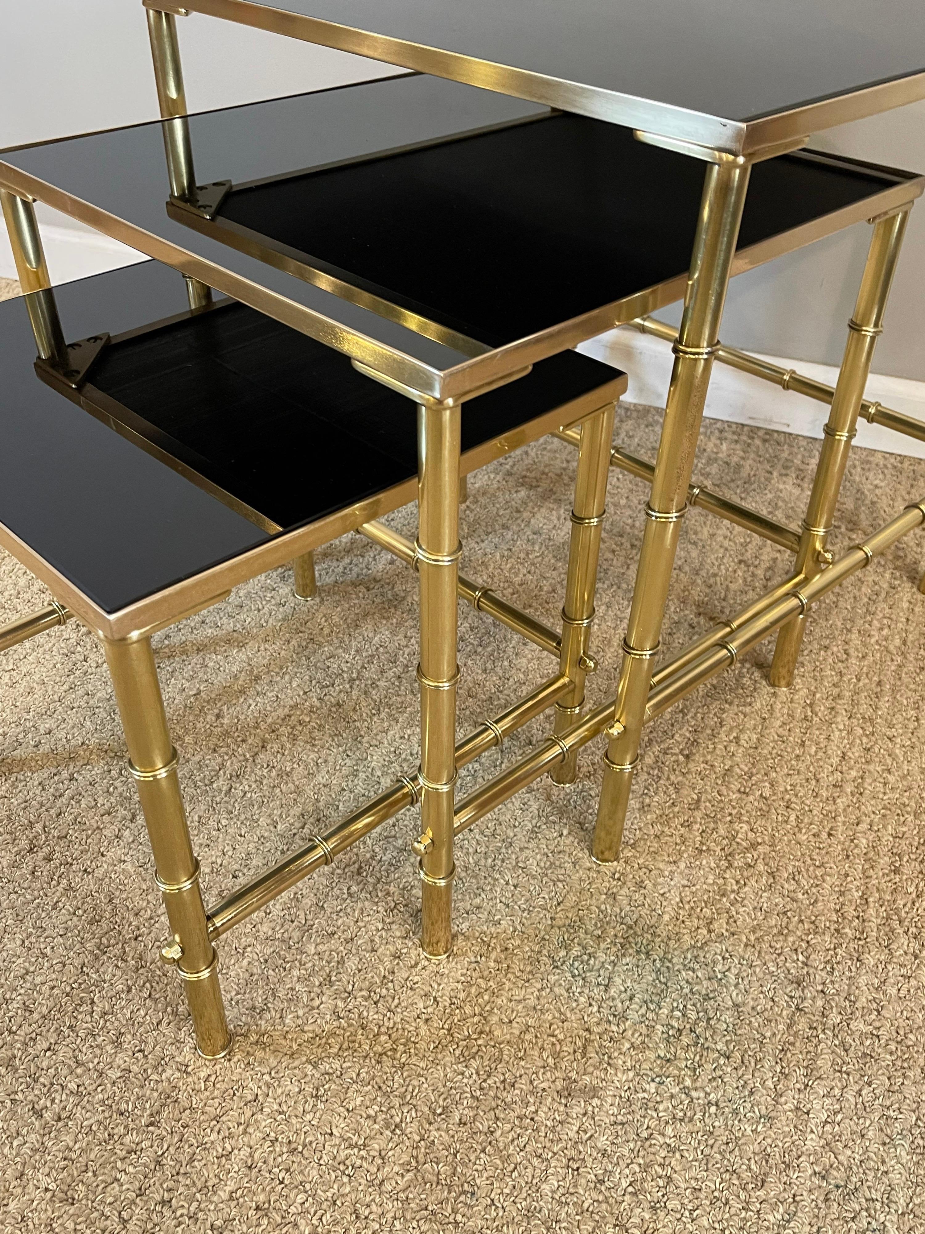 Polished Jansen Brass Faux Bamboo Set of 3 Nesting Tables with Black Vitrolite Glass For Sale