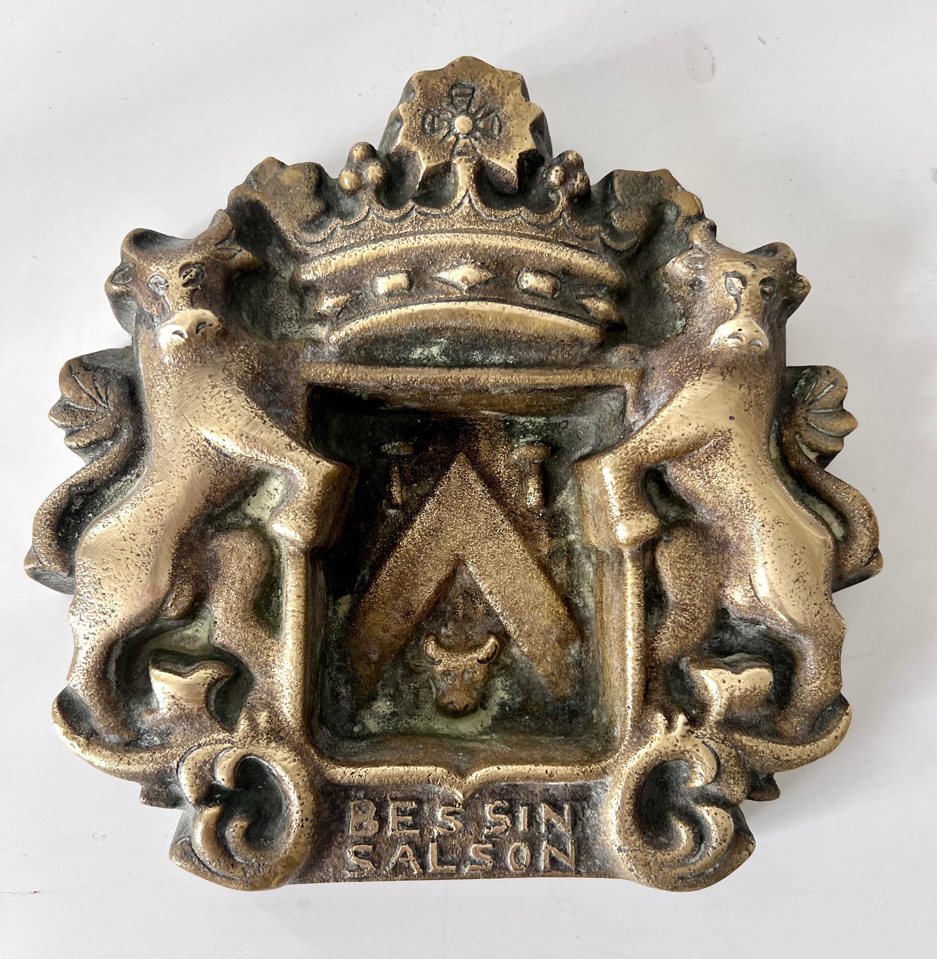 Acquired in Paris France, a solid brass ashtray or catch all that has a Coat of Arms or Crest with Two Cows and a Crown. A compliment to any bar or cocktail area. Works with things like 420 to desktop items.