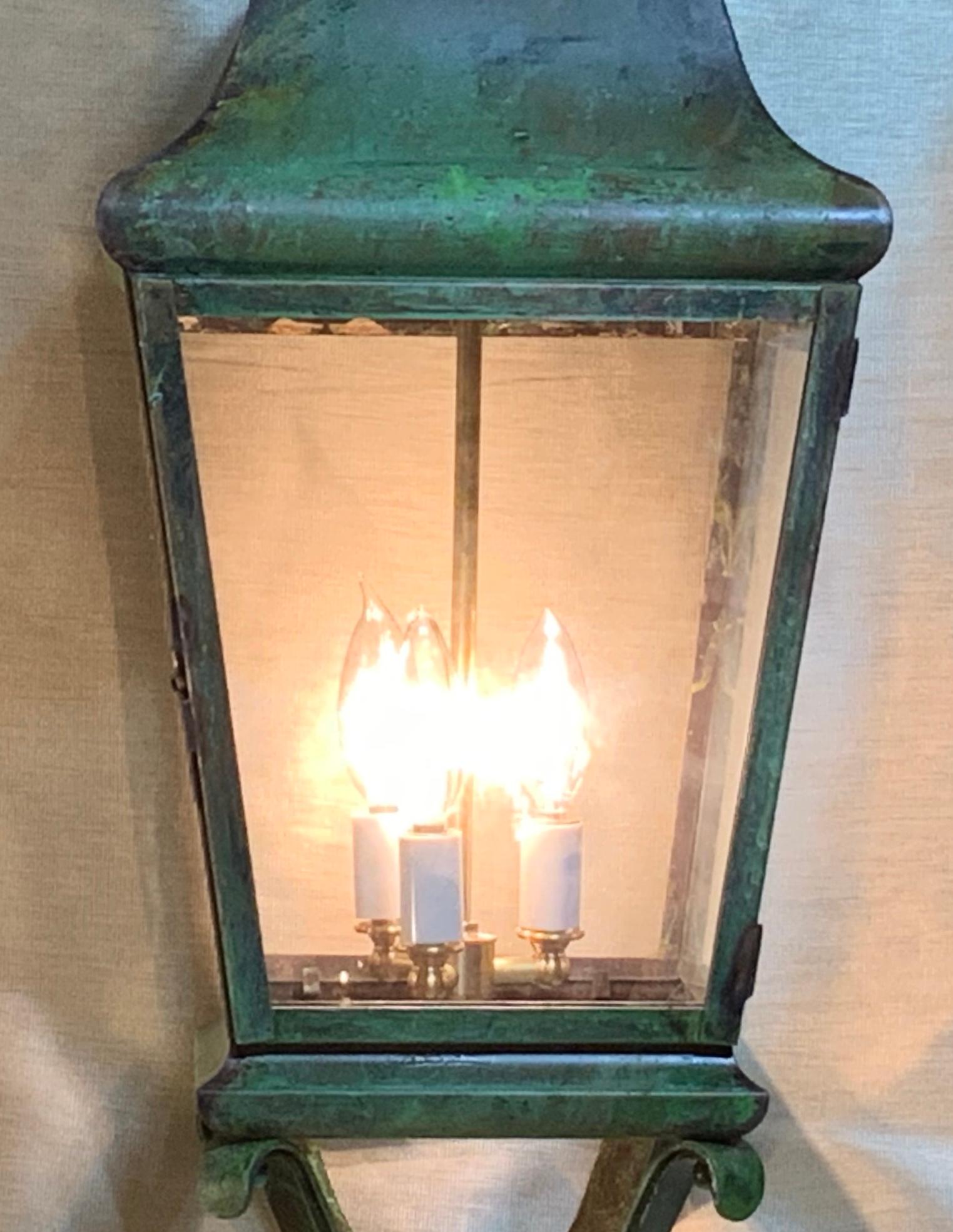 Elegant hanging lantern made of solid brass with three 60/watt lights, suitable for wet locations ready to use