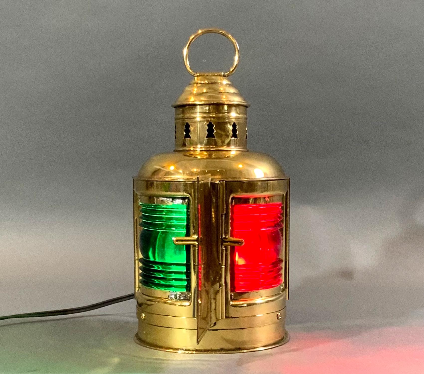 Highly polished and lacquered nautical boat lantern by Perko of Brooklyn NY. With mounting flange, vented chimney, and original brass ring. Also has the rarely found center vane of solid brass. Meticulously polished and lacquered, then rewired for