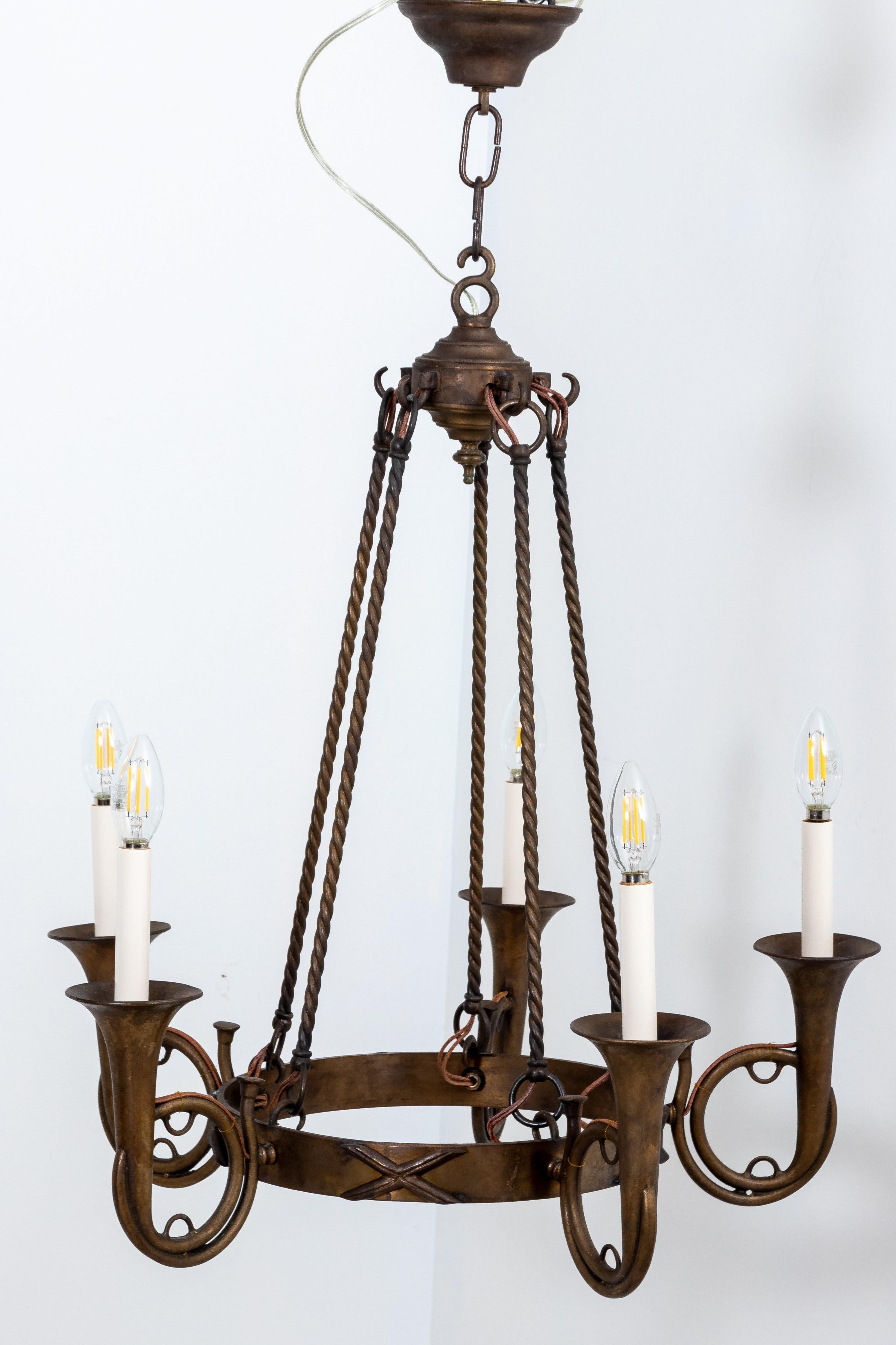 Brass Hollywood Regency hunting horn chandelier with five arms. Includes original ceiling canopy. Rewired with extra long wire. Extra chain can be added to increase length.