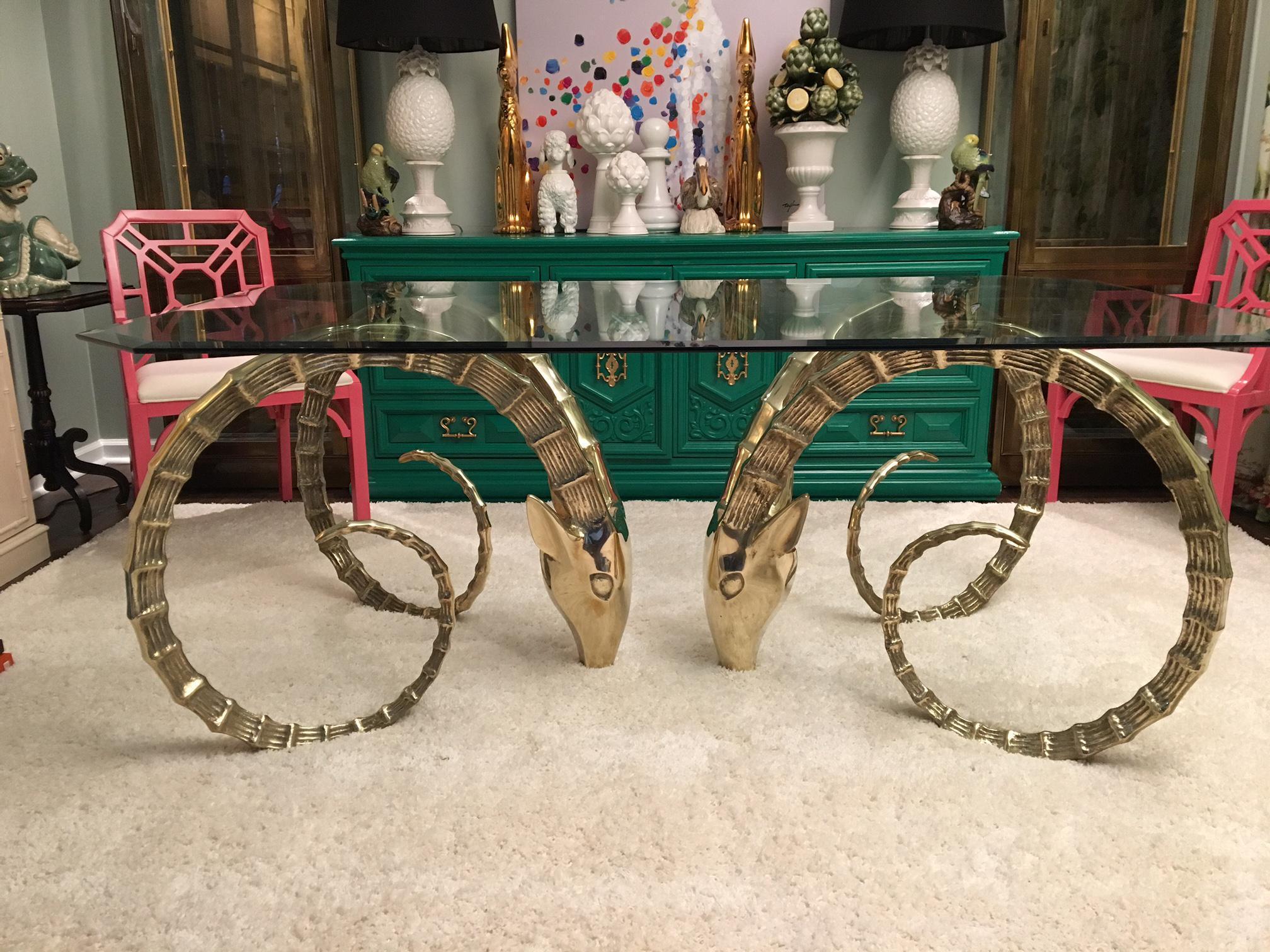 Monumental solid brass Ibex ram's head dining table with your choice of glass top. 

Glass top (shown in first photo) measures 90