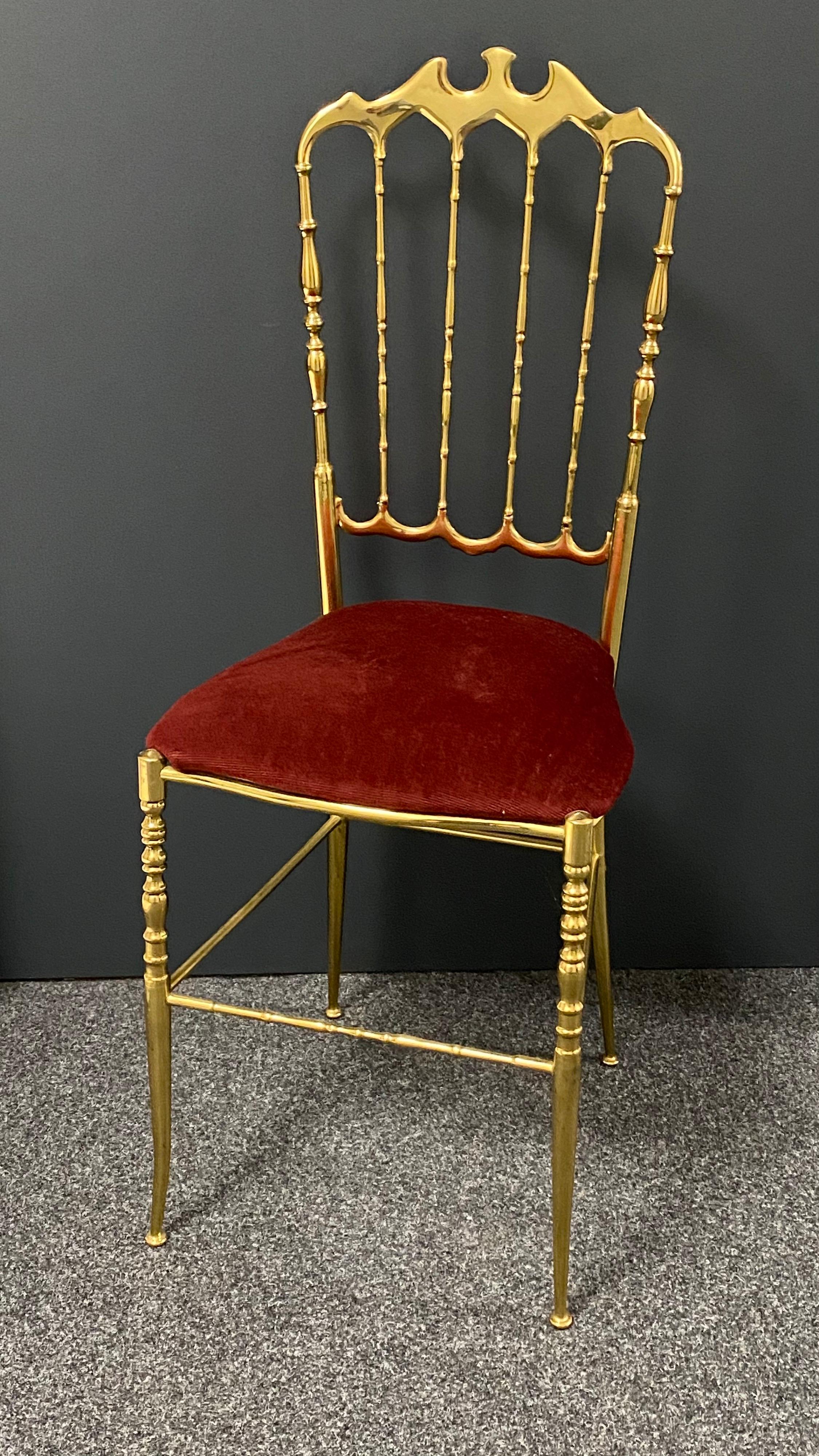 Offered is a solid brass desk chair by Chiavari, circa 1950. It shows some minor scratches, also patina and has got the original velvet upholstery. Minor patina gives this pieces a classy statement.