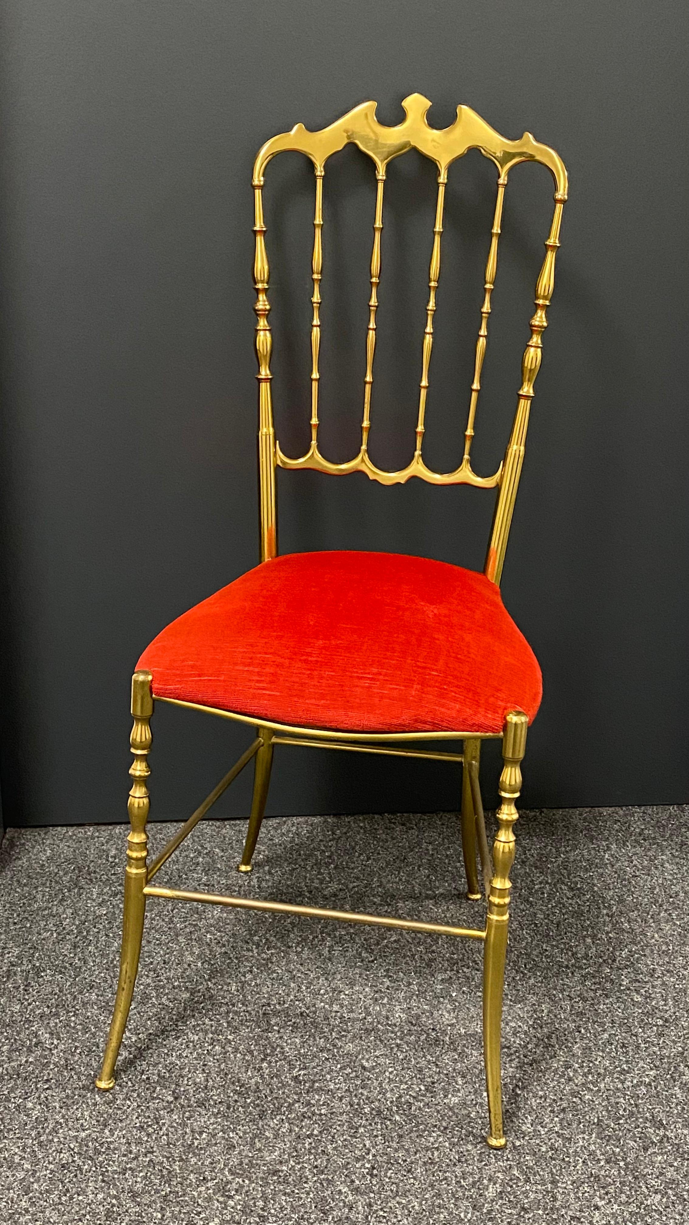 Offered is a solid brass desk chair by Chiavari, circa 1950. It show some minor scratches, also patina and has got the original velvet upholstery. Minor patina gives this pieces a classy statement.