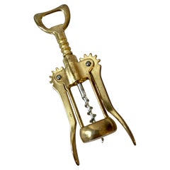 Apribottiglie italiano in ottone massiccio.