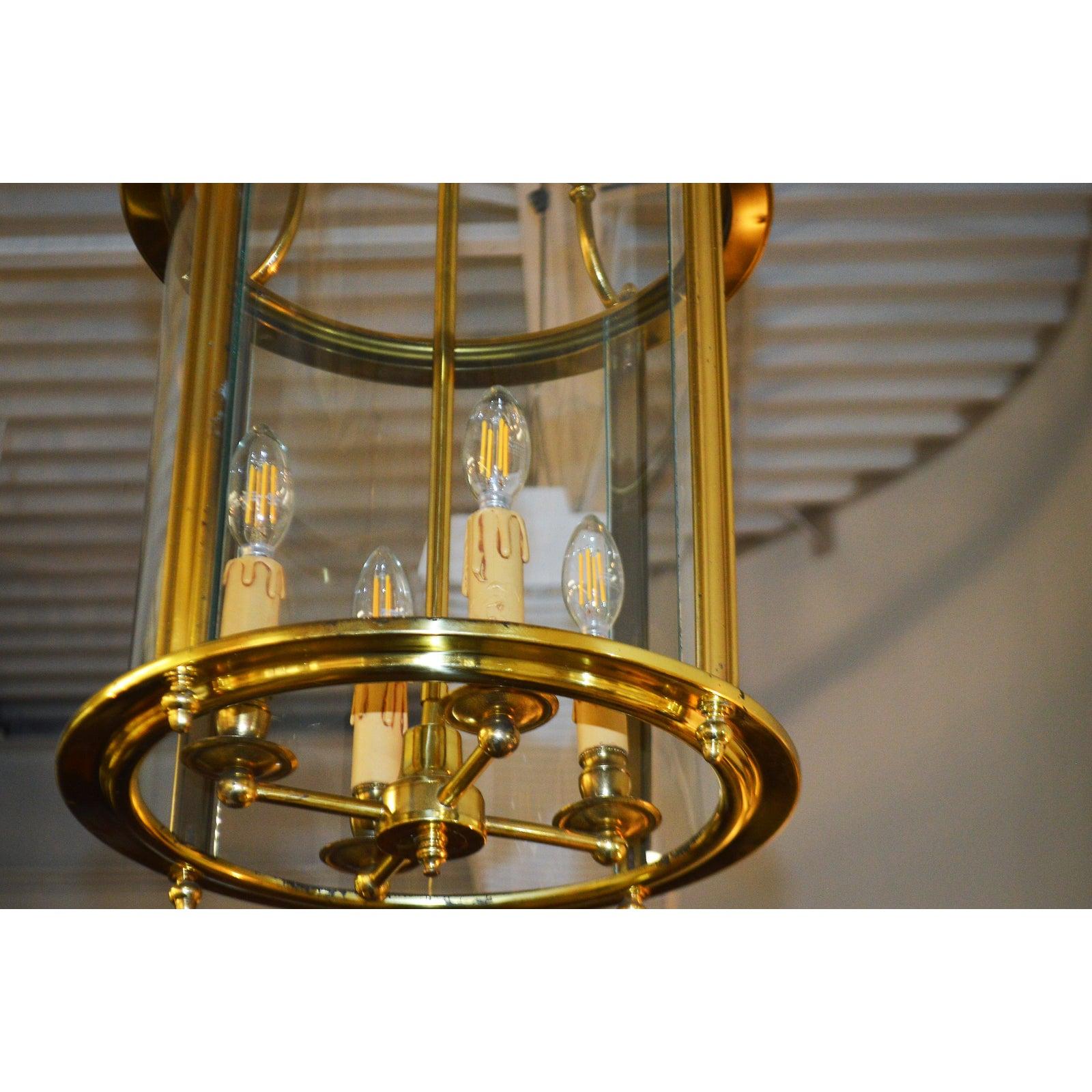 Solid brass lantern has the original glass cage in excellent condition. The drip candle holders are original and in excellent condition as well. The height is 27