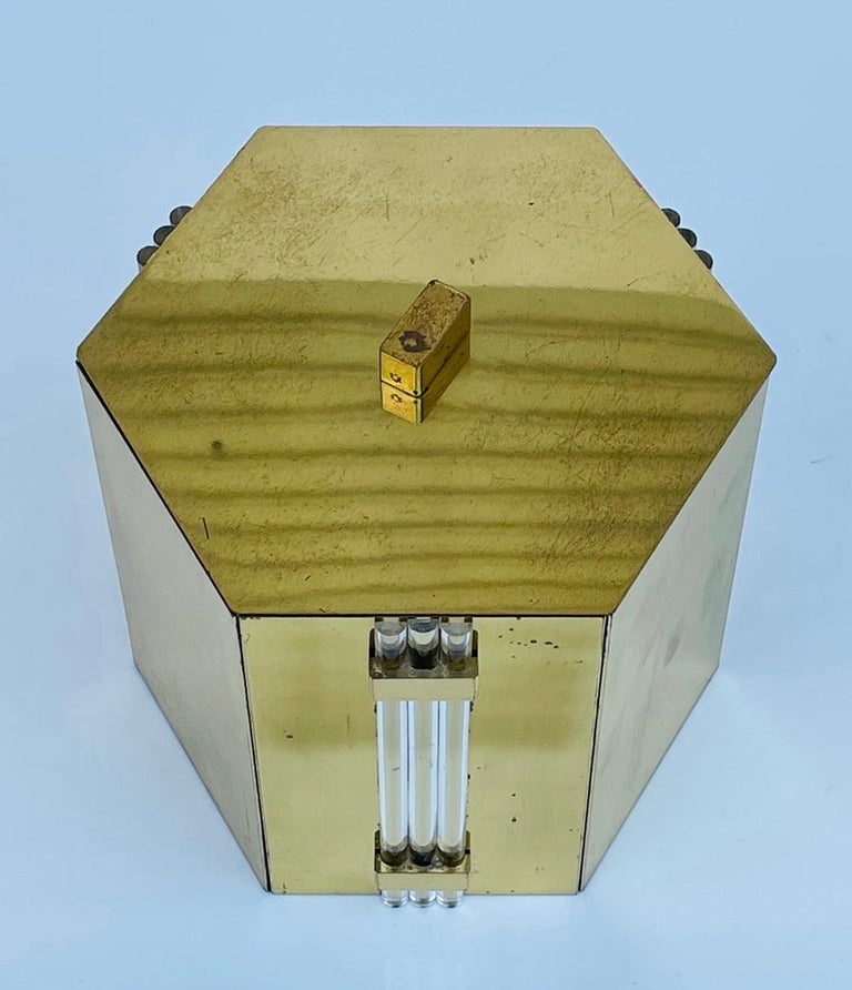Beautiful ice bucket made in Italy in solid brass and Lucite accents made in Italy in the 1960's by Noel B.C. 

The piece has a hexagonal shape and it presents real well.

Measurements:
9 inches wide x 8.50 inches deep x 8.50 inches high.