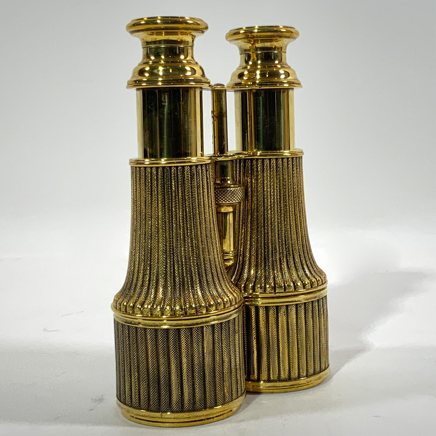 Exceptional pair of French yachting binoculars. Polished and lacquered gentleman's binoculars with geared focal tubes. Interesting design that resembles rope. Clean and clear. Wonderfully restored. Circa 1890.