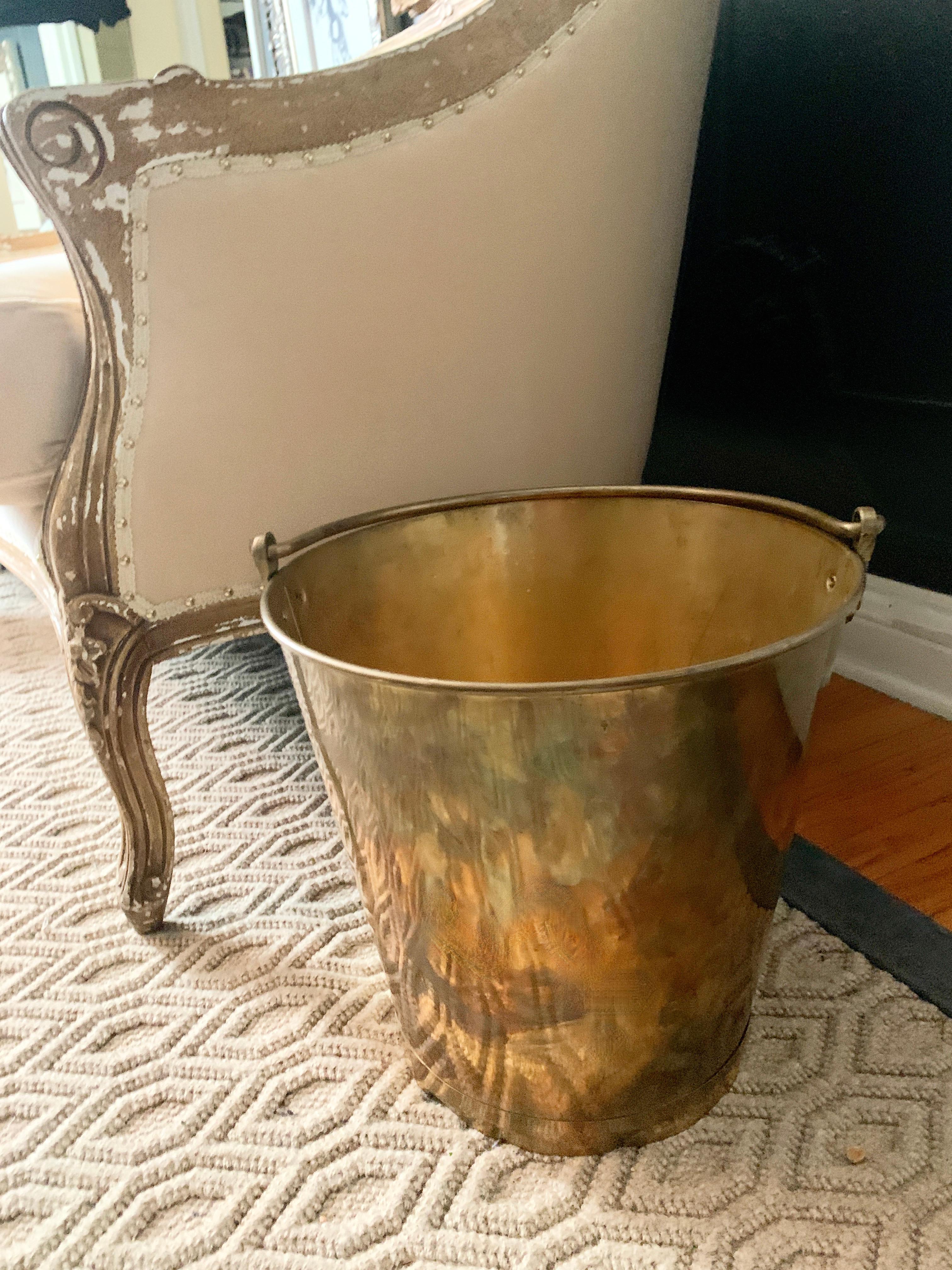 A unique pale made of brass. The handled piece has a wonderful patinated finish - while the piece could easily be polished to a high sheen, we have left the patination. The piece can be used in the kitchen as a waste bin, water pale, cleaning pale.