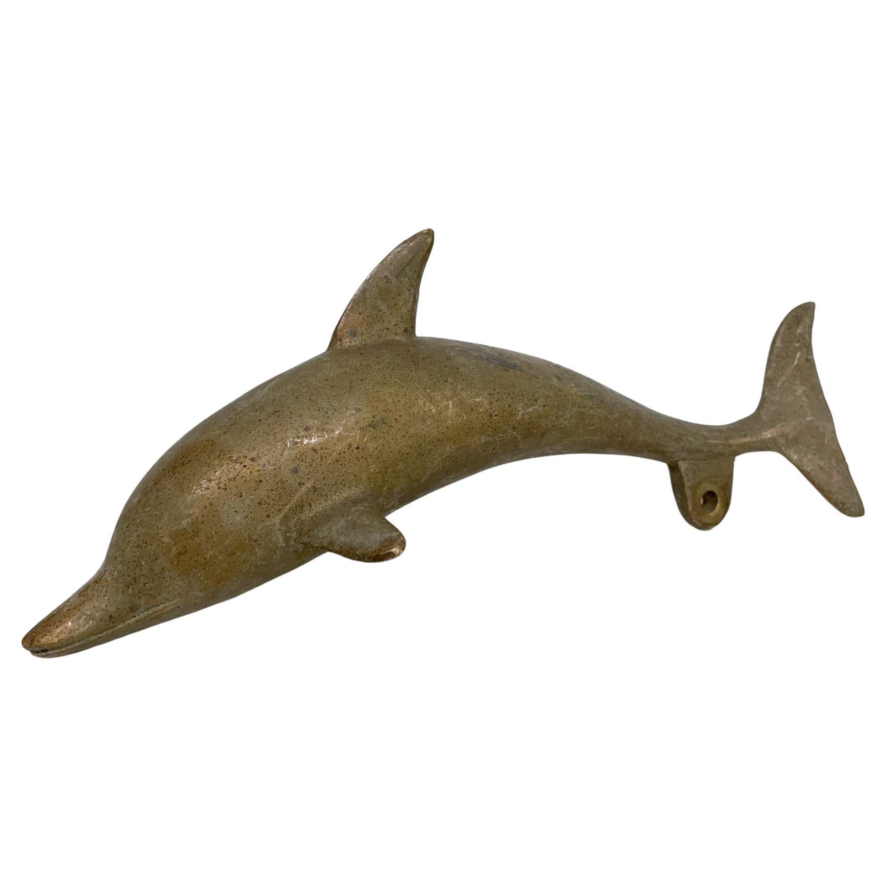 Dolphin
Dolphin Art Sculpture paperweight in solid brass,
Heavy for paper weight, unsigned.
It has a hole which can be used for hanging.
Measures: 8 L x 3 W x 3.25 H
Original preowned Vintage condition.
Refer to images.


