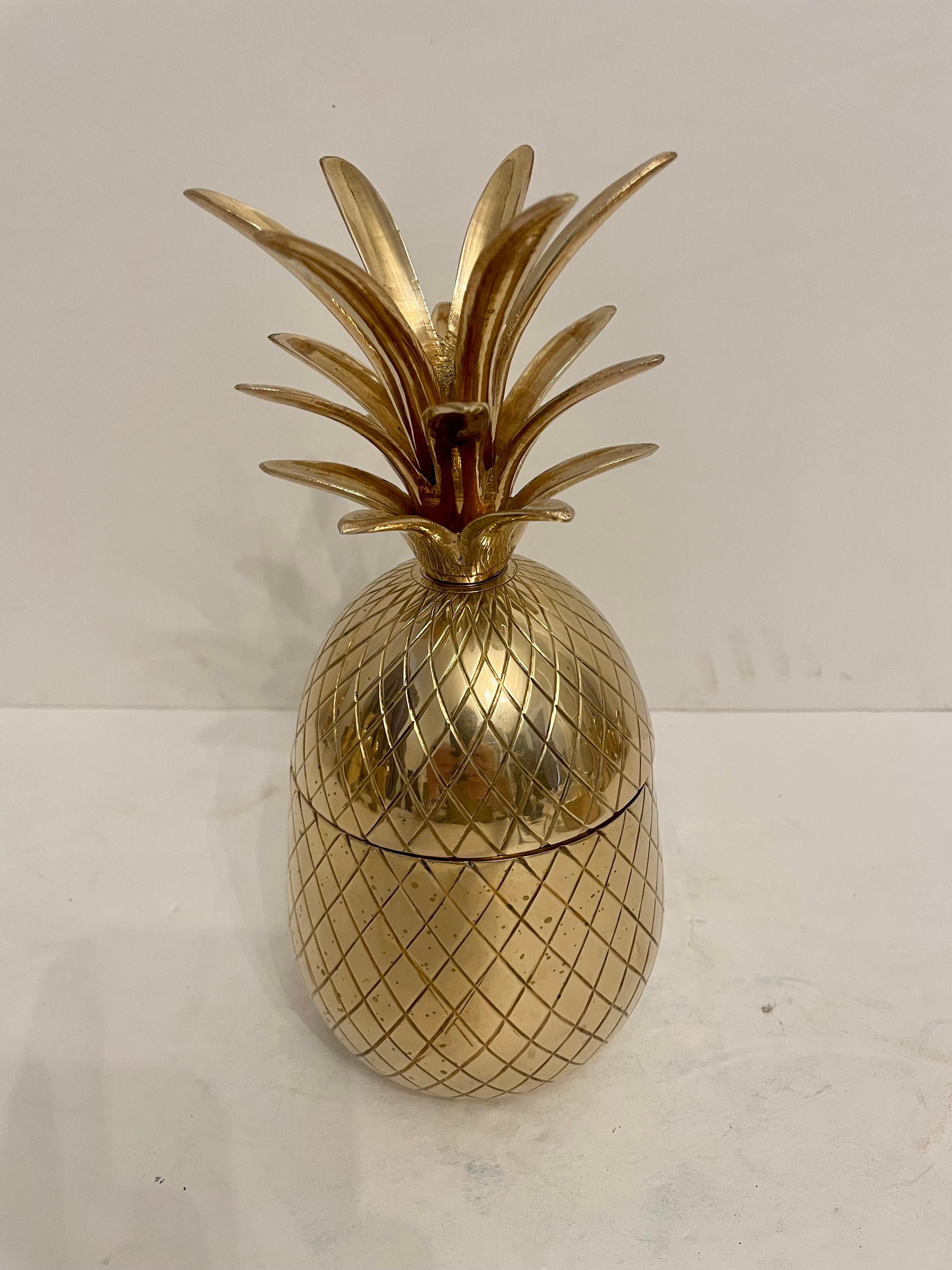 Brass Pineapple Shaped Covered Container. Good overall condition. Any dark areas in photos is reflection.  Hand polished. 9.75” tall x 4.5” diameter. Any dark spots are shadows from light.