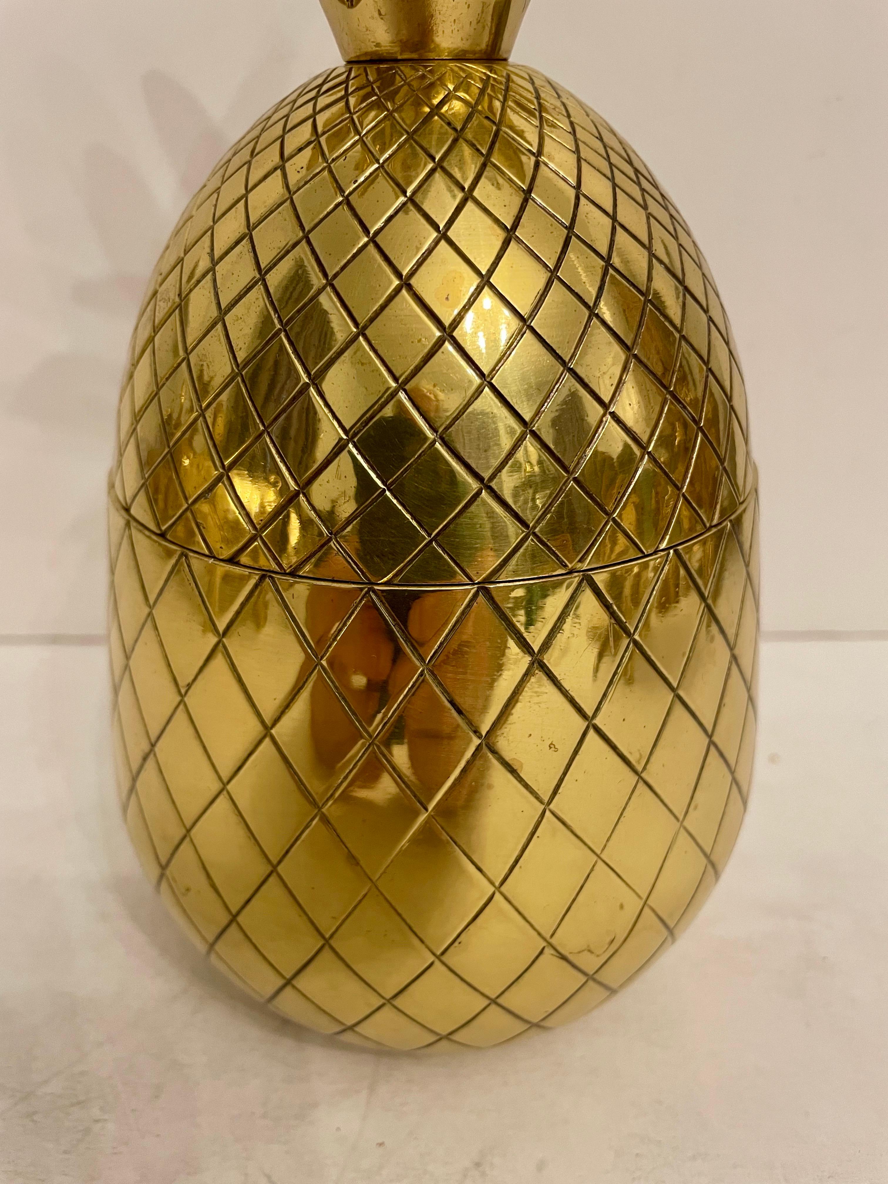 Brass Pineapple Shaped Covered Container. Good overall condition. Any dark areas in photos is reflection.  Hand polished. 9.5” tall x 4.5” diameter. Any dark spots are shadows from light.