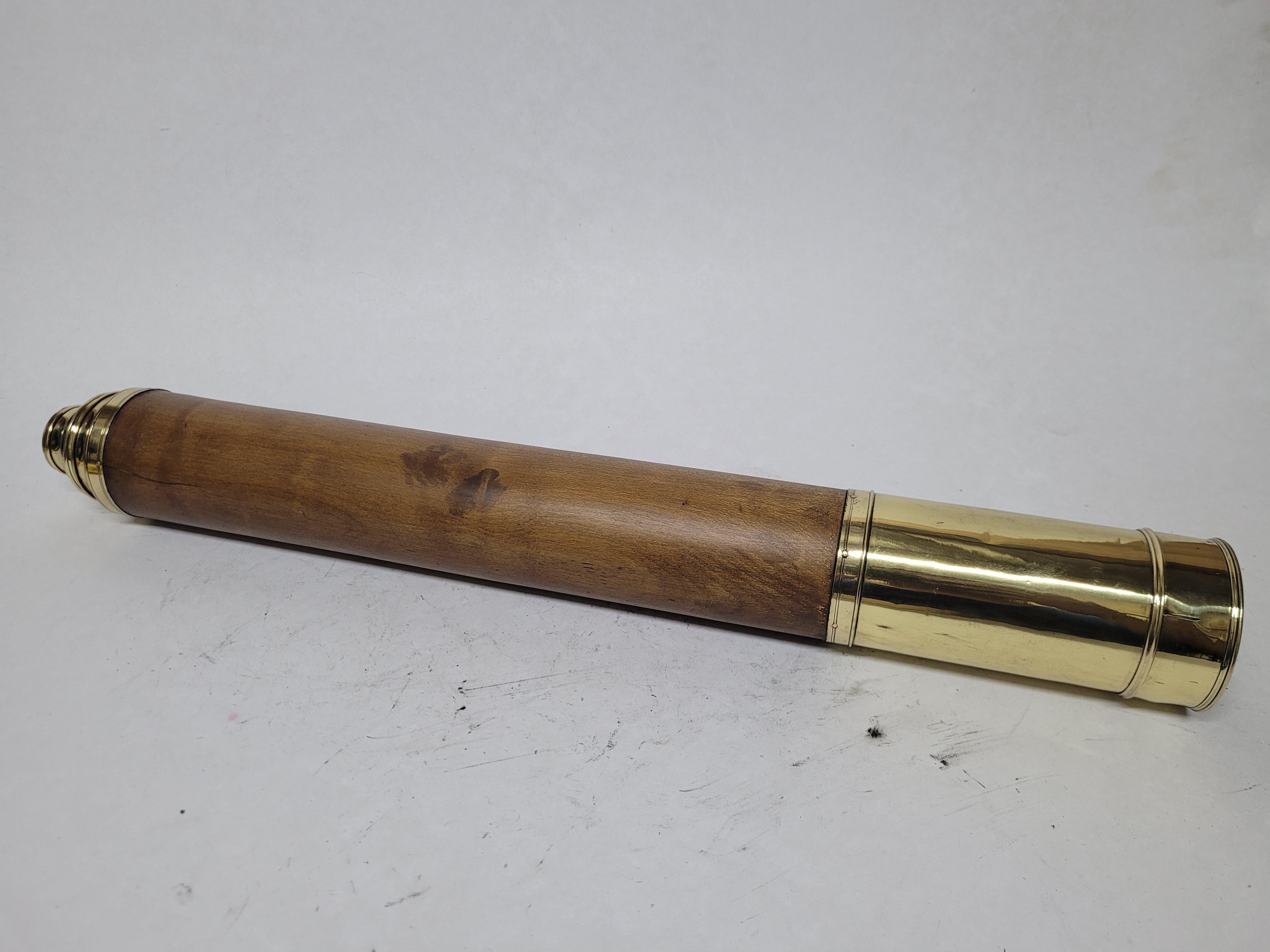 Ships spyglass telescope appropriate for use on a yacht, ship, or anywhere with a view. This has been meticulously polished and lacquered. We just restored a great collection of these. This fine instrument has a varnished wood barrel of elmwood, and