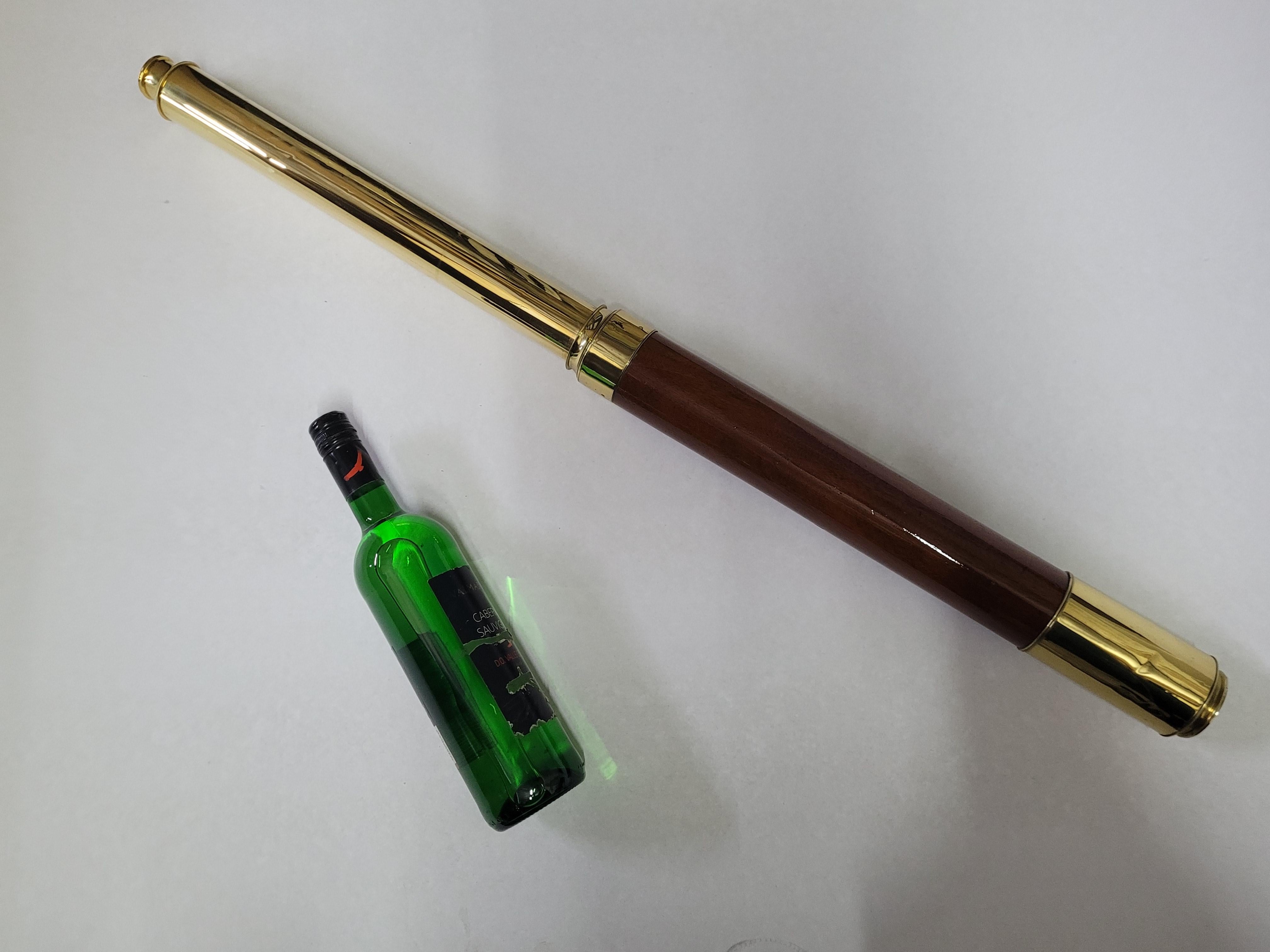 Ships spyglass telescope appropriate for use on a yacht, ship, or anywhere with a view. This has been meticulously polished and lacquered. We just restored a great collection of these. This fine instrument has a single draw barrel of mahogany. The
