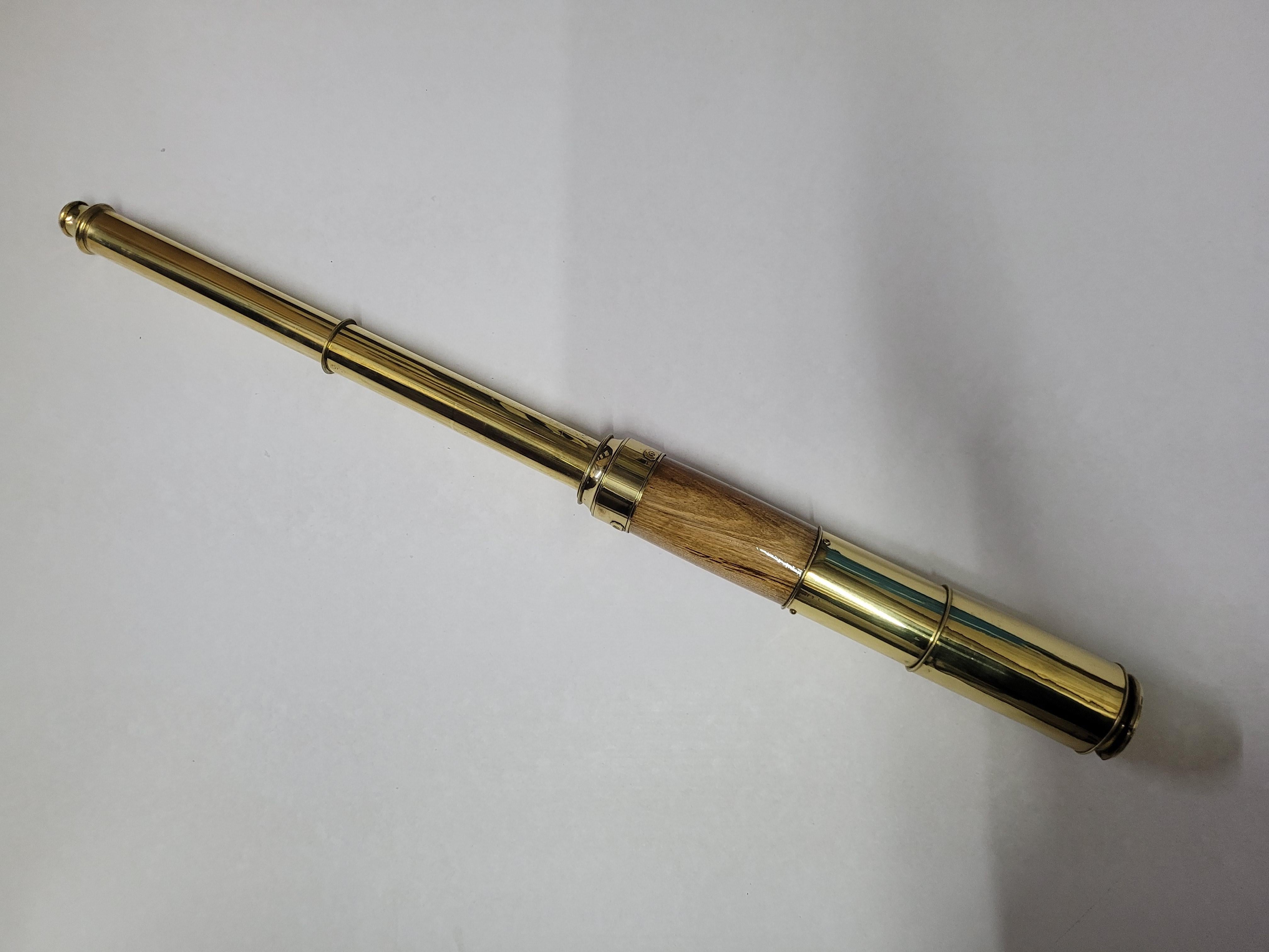 Ships spyglass telescope appropriate for use on a yacht, ship, or anywhere with a view. This has been meticulously polished and lacquered. We just restored a great collection of these. This fine instrument has a two draw barrel of varnished oak.