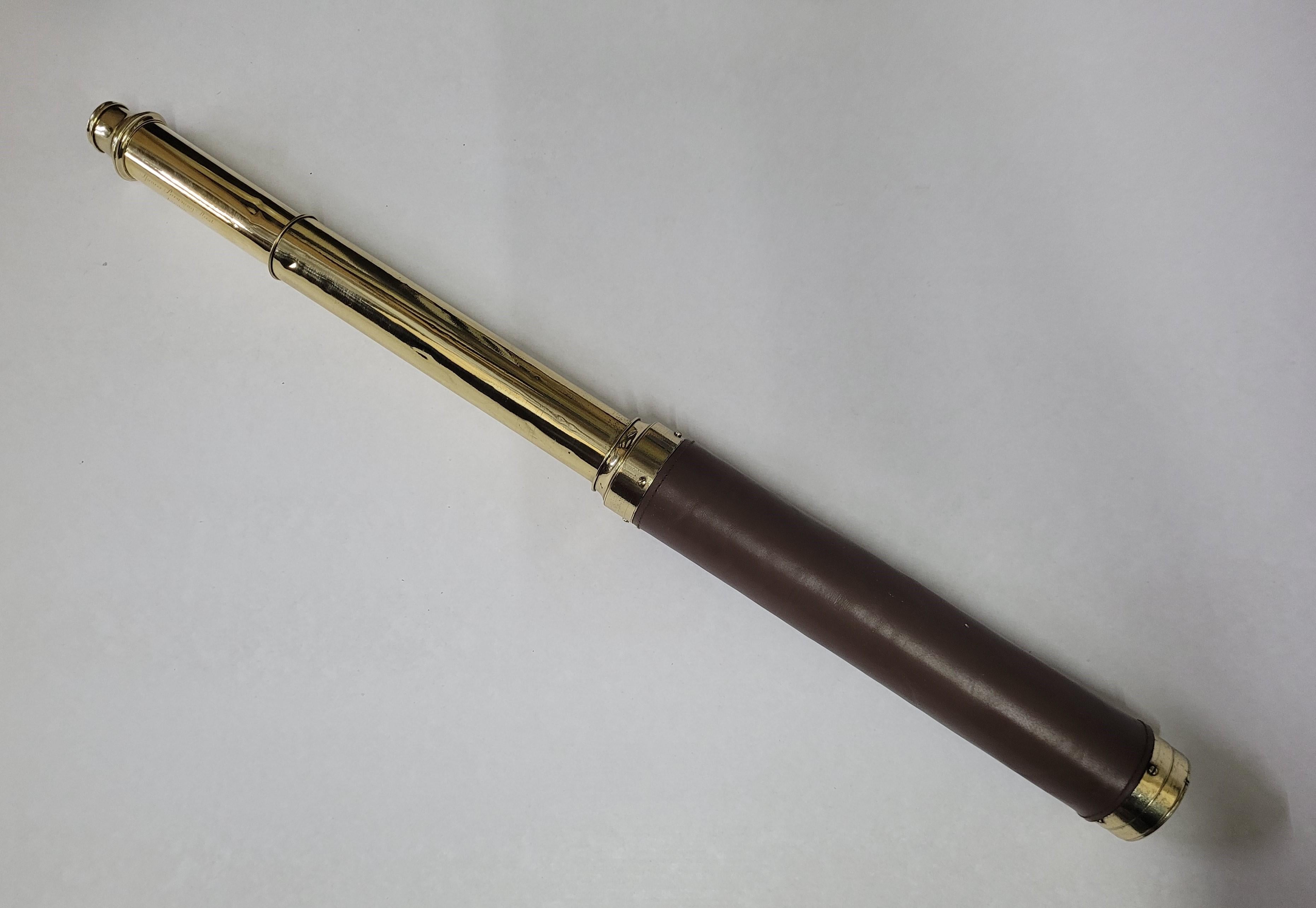 Ships spyglass telescope appropriate for use on yacht, ship, or anywhere with a view. This one has its barrel covered in brown leather. This marine relic has been meticulously polished and lacquered. We just restored a great collection of these.