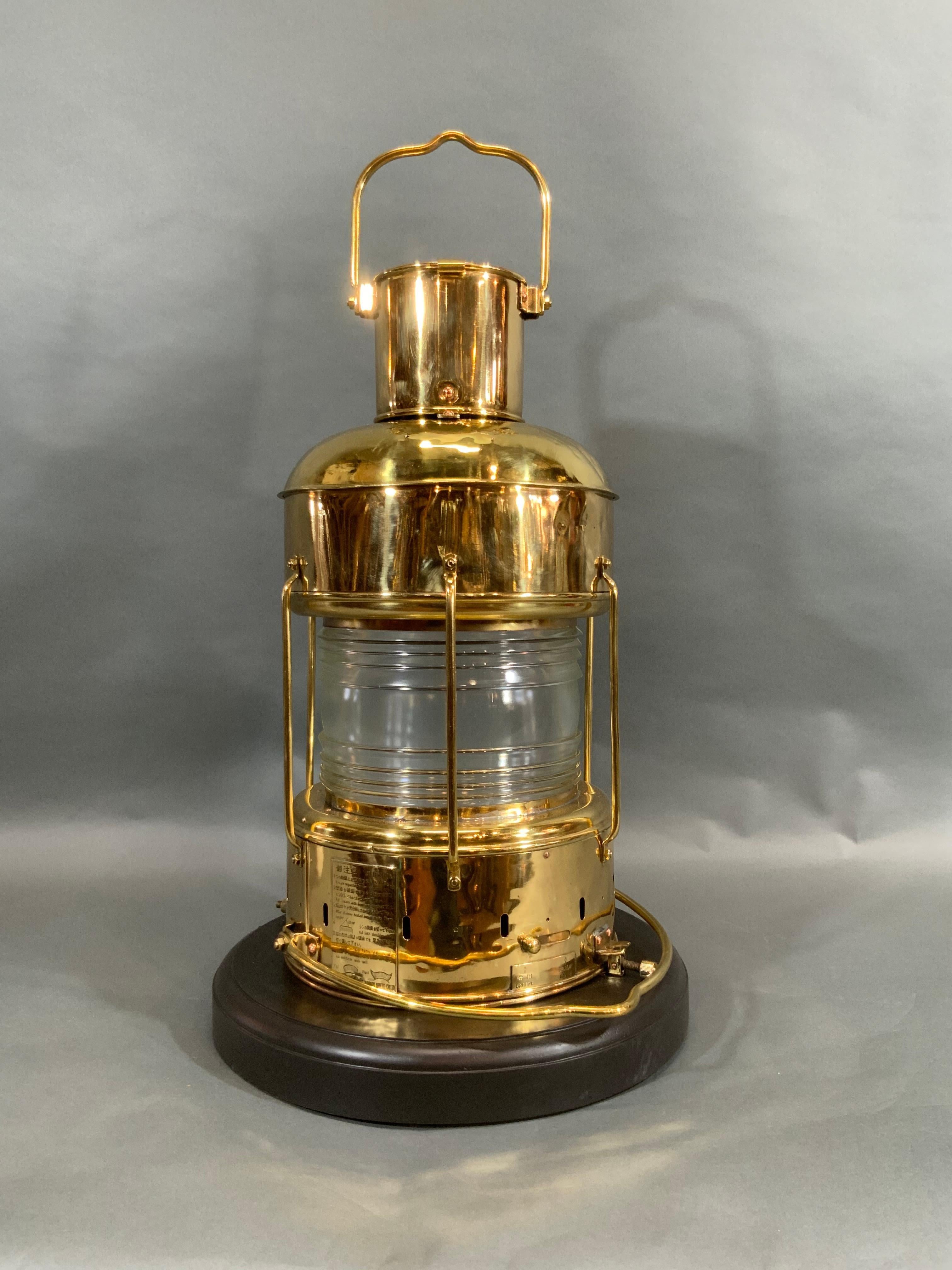 Ship's lantern, solid brass anchor lantern by Japanese maker Nippon Sento Co. LTD, Tokyo, Japan. Circa 1970. This was a back up emergency lantern from a supertanker in the event it lost all power. Glass Fresnel lens. Meticulously polished and
