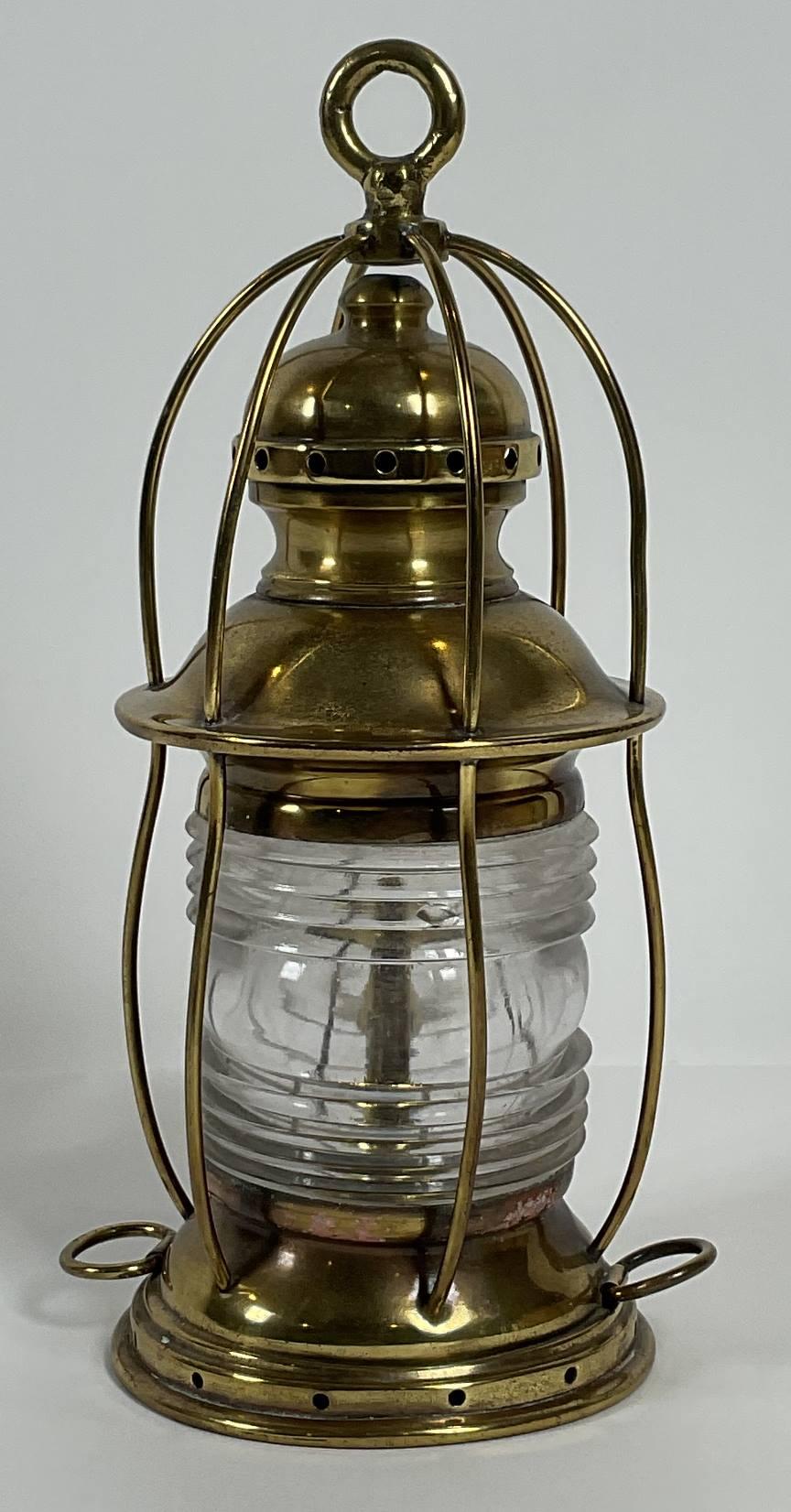 Ships anchor lantern with brass hoisting ring with protective brass rods. Vented top, Tether rings, Burner, etc.. 12