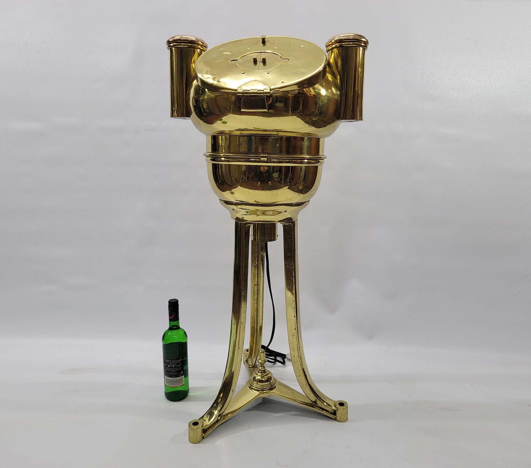 Early twentieth century ships binnacle with mushroom top, gimballed compass, three legged stand, etc. Meticulously polished and lacquered. Hinged door on the hood. Interior has been fitted with soft lighting. Circa 1920. Exceptional.

Weight:    48