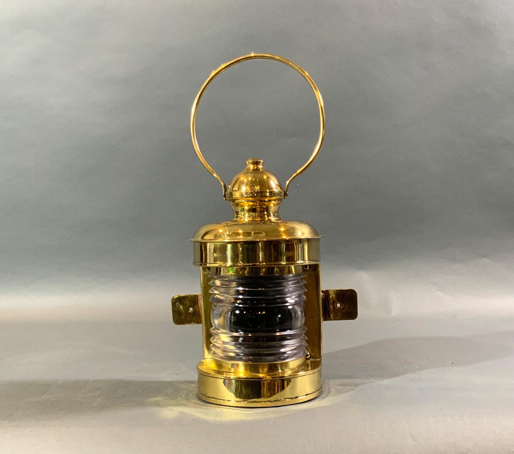 Highly polished and lacquered one hundred-year-old ship’s lantern with Fresnel glass lens, mounting flanges, hoop carry handle, etc. Maker’s name is Perkins Marine Lamp Corporation, Brooklyn, N.Y. Wired for home use. Special piece.

Weight: 8