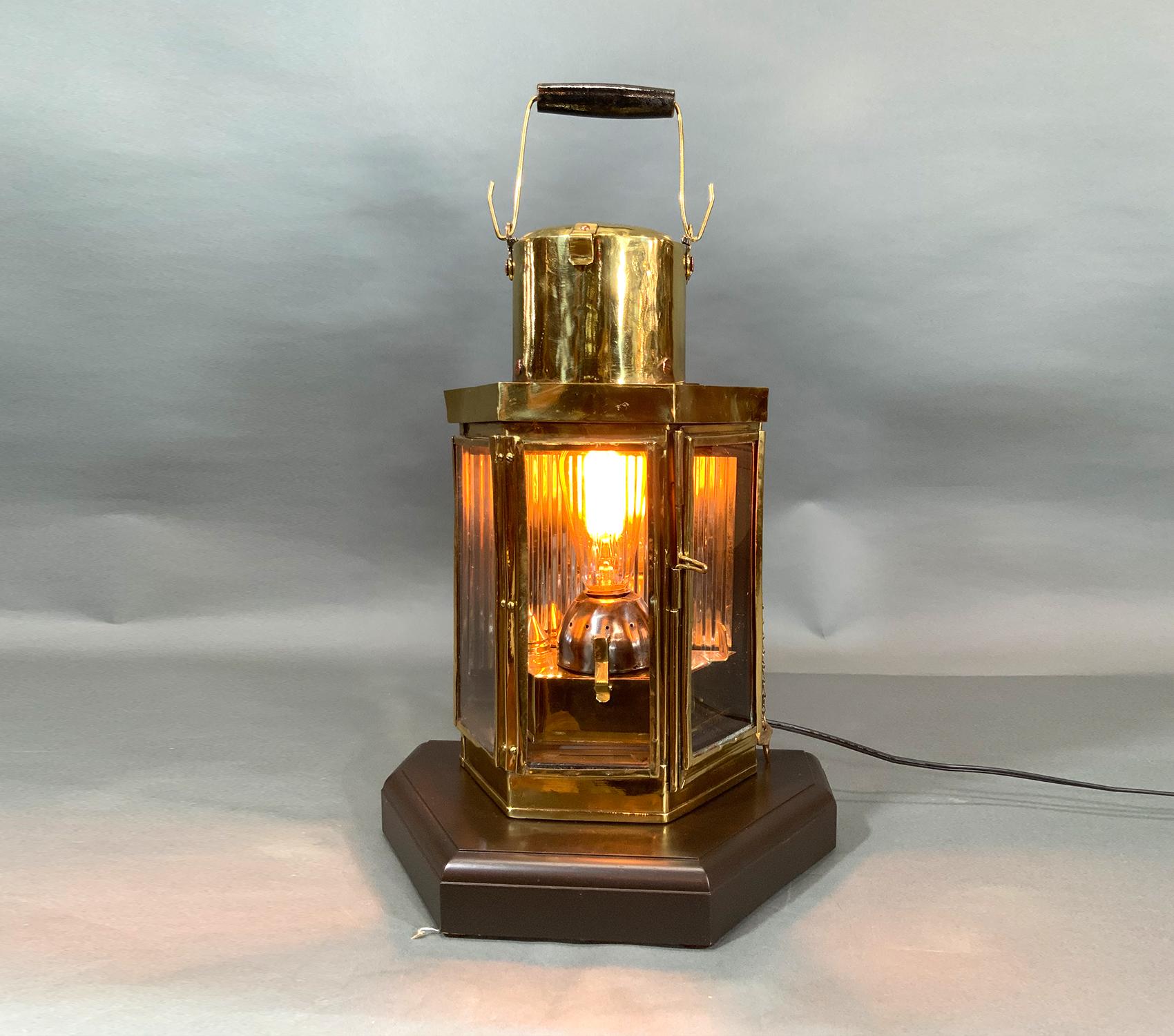 With three glass panels. Solid mahogany base. Wood handle. Electric socket with Edison bulb has been fitted to the original burner for home enjoyment.

Weight: 12 LBS
Overall Dimensions: 17