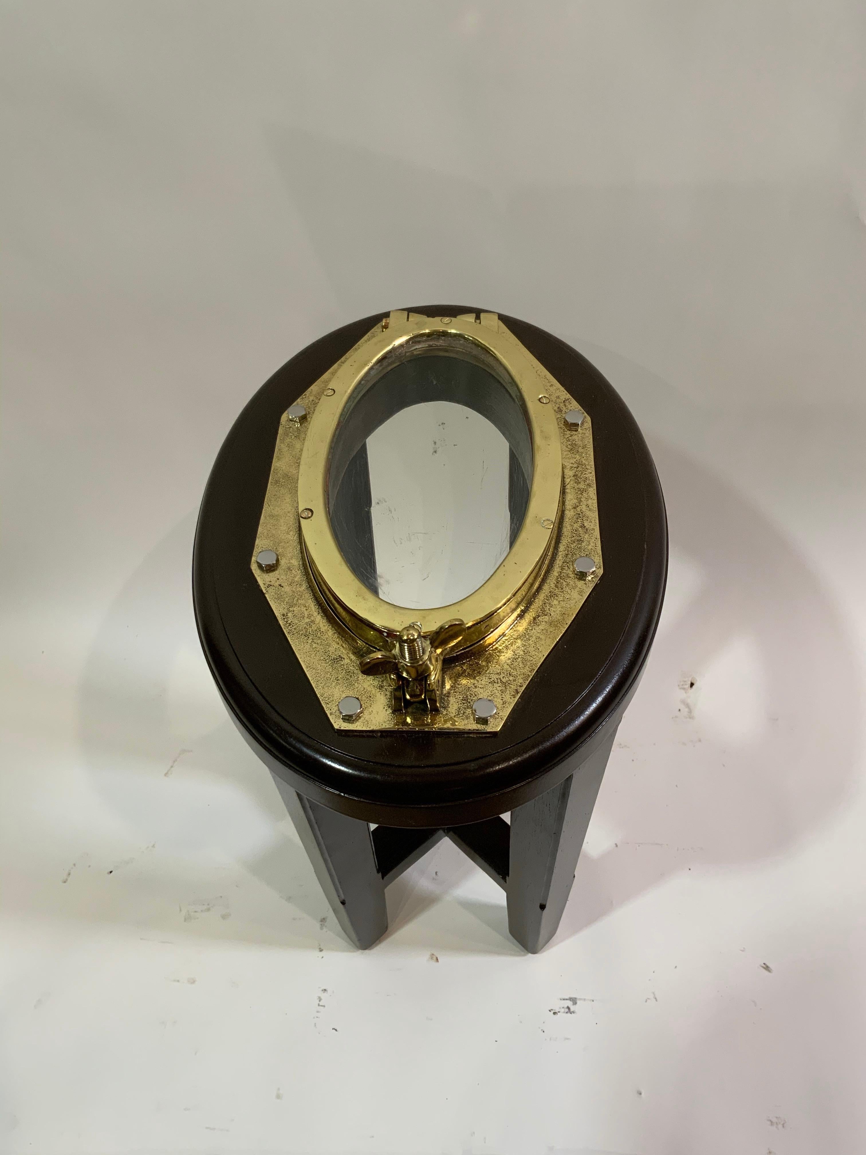 Solid Brass Ships Porthole Mounted To A Mahogany Table Base In Excellent Condition For Sale In Norwell, MA
