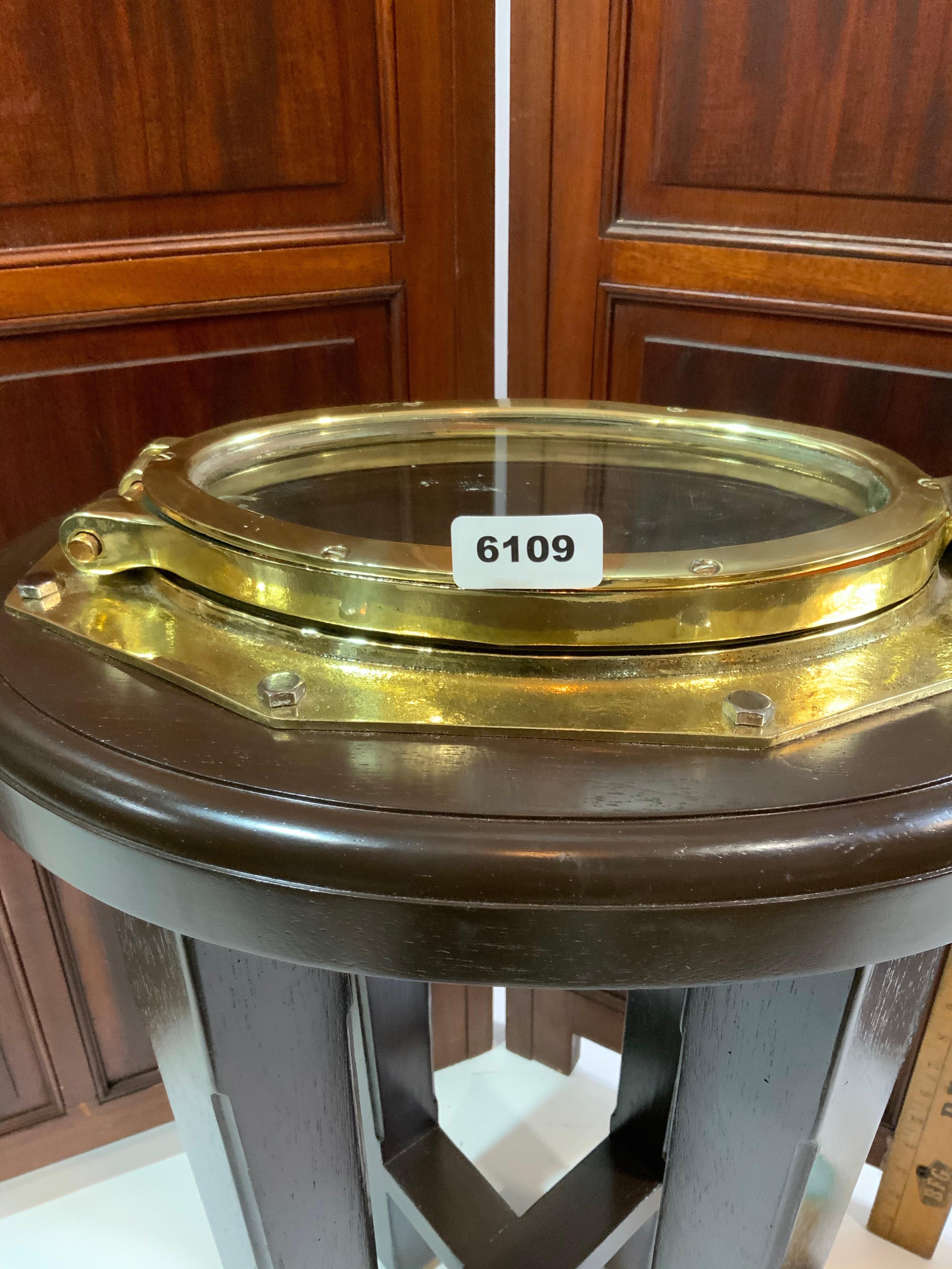 Solid Brass Ships Porthole Mounted To A Mahogany Table Base For Sale 2