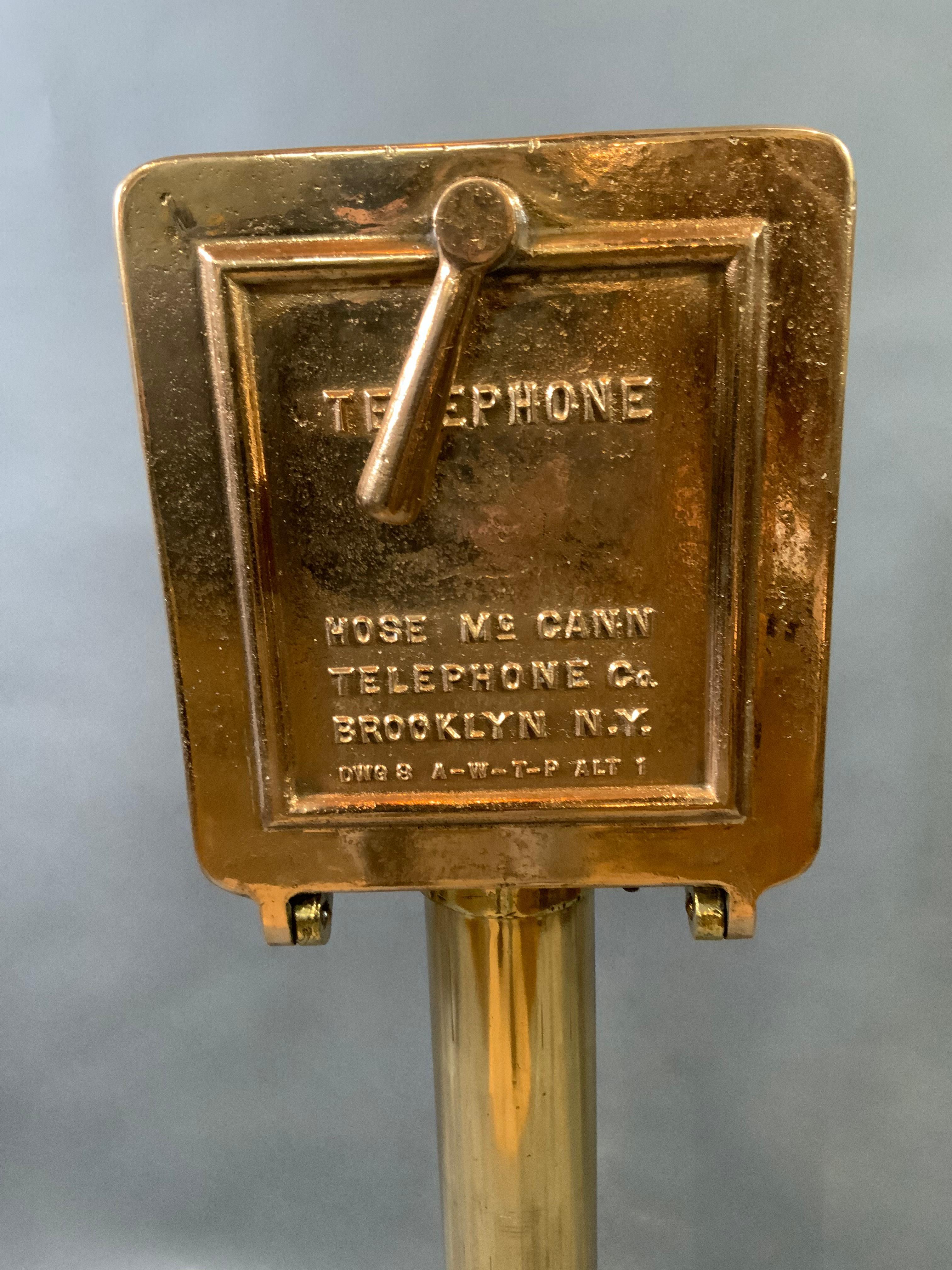 Solid brass ships telephone on pedestals. Phone is fitted inside an incredibly strong solid brass box that is highly polished and lacquered. Weight is 88 pounds. Dimensions 46 tall by 12 wide by 8 deep. $3295.