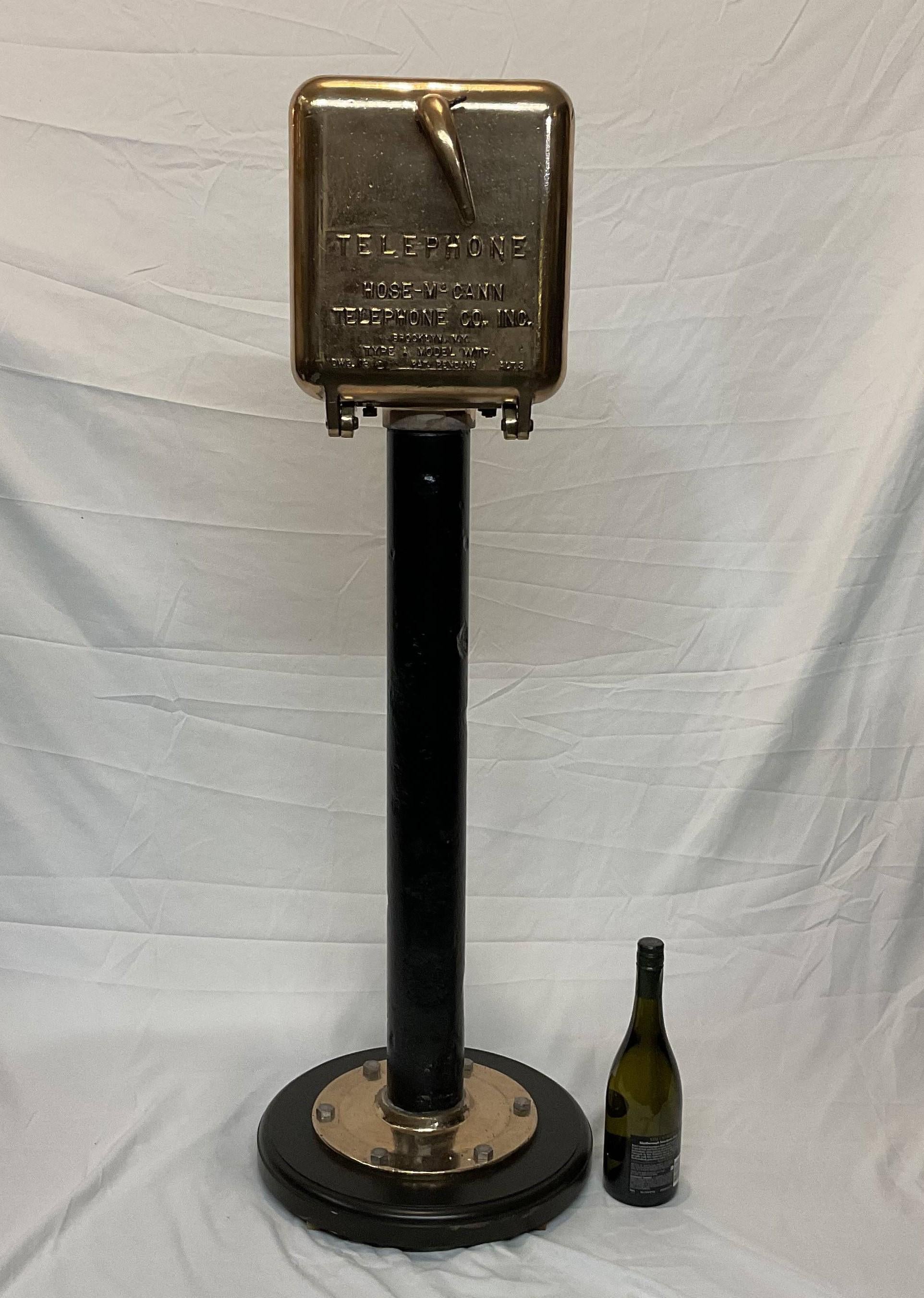 Highly polished brass ships telephone on pedestal. Meticulously polished andl lacquered head by Hose-McCann Telephone Co, Inc., Brooklyn New York. Type A, model WTP, with phone inside. 

Weight: 89 lbs.
Overall Dimensions: 47