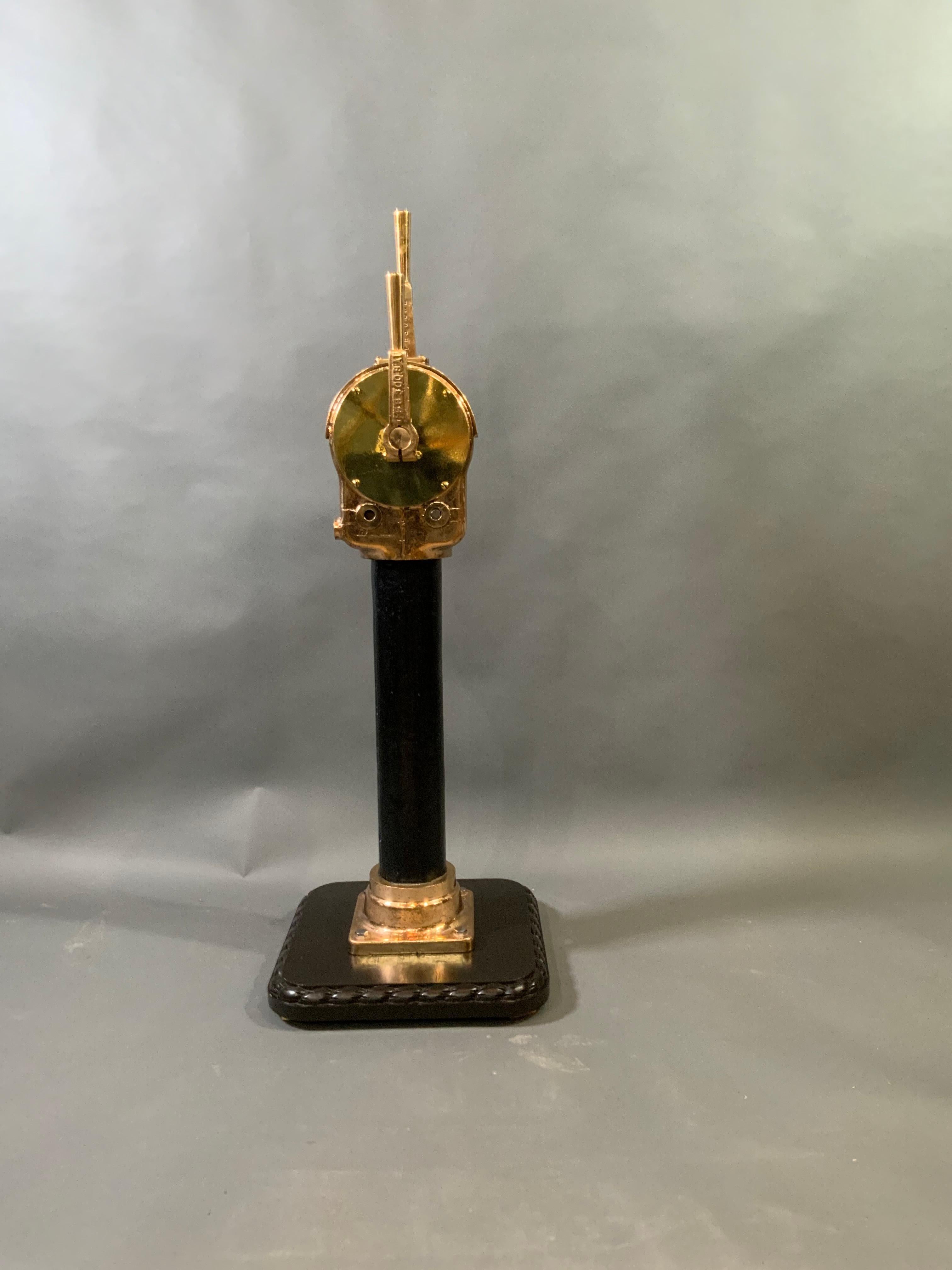Solid brass ships throttle on stand. Highly polished and lacquered. Twin handle design. Weighs 92 pounds. Height is 39 by 8 by 9. Mounted to a 17 inch square base. Price $2895.