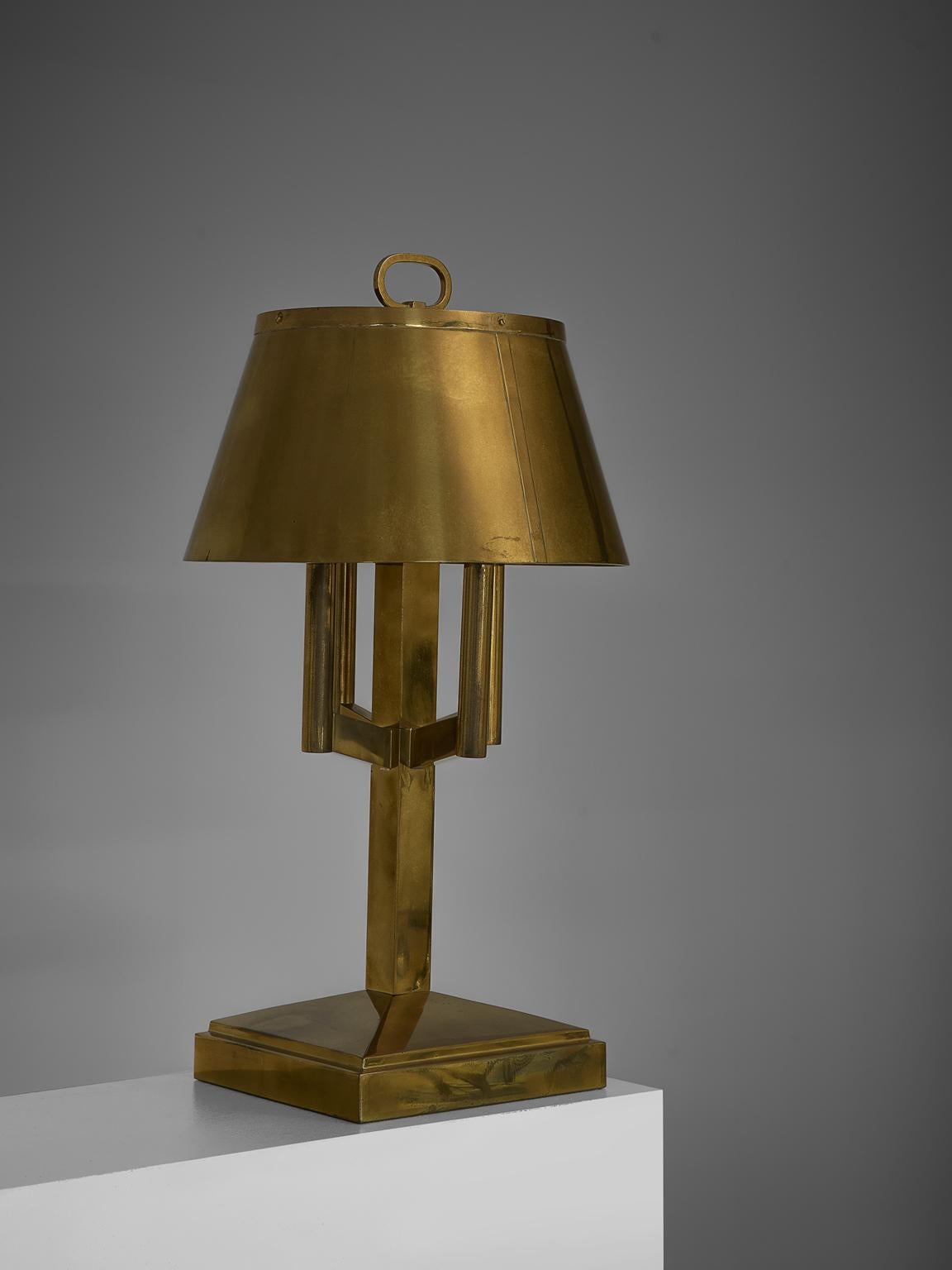Table lights, brass, Italy, 1940s.

This strong and sturdy table lamp bears strong traits of the Classic shaded desk light. Yet the shades are combined with an strong, angular bases, giving them a modern aesthetic. These lamps have, due to time and