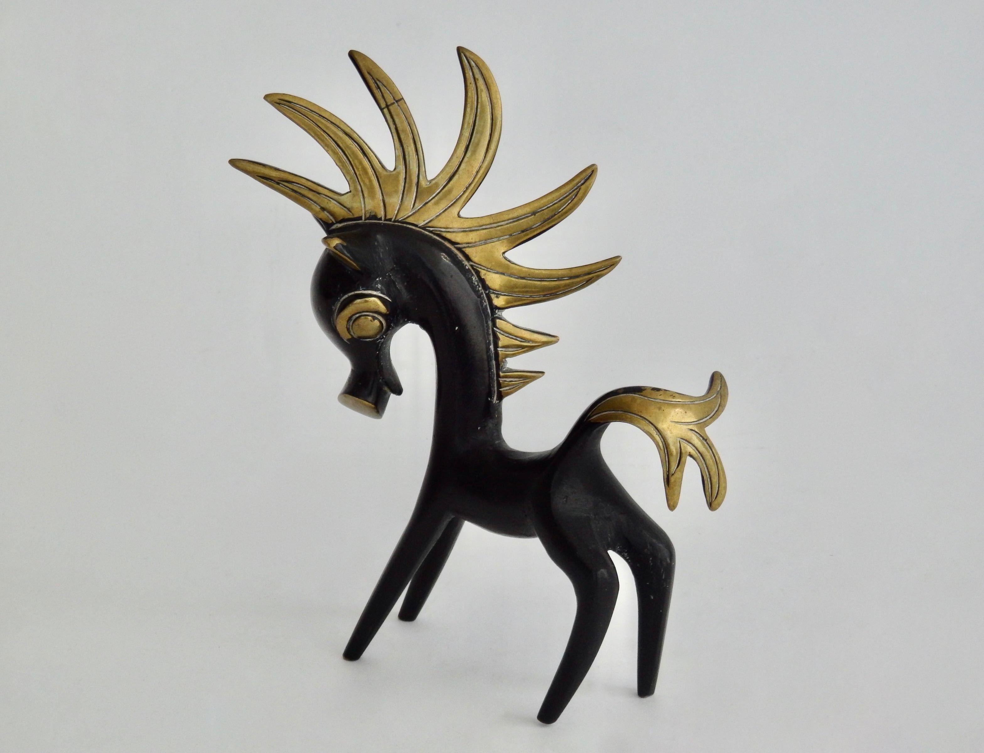 A solid brass with patina'd accents charming horse figurine in the style of Walter Bosse.
5.38