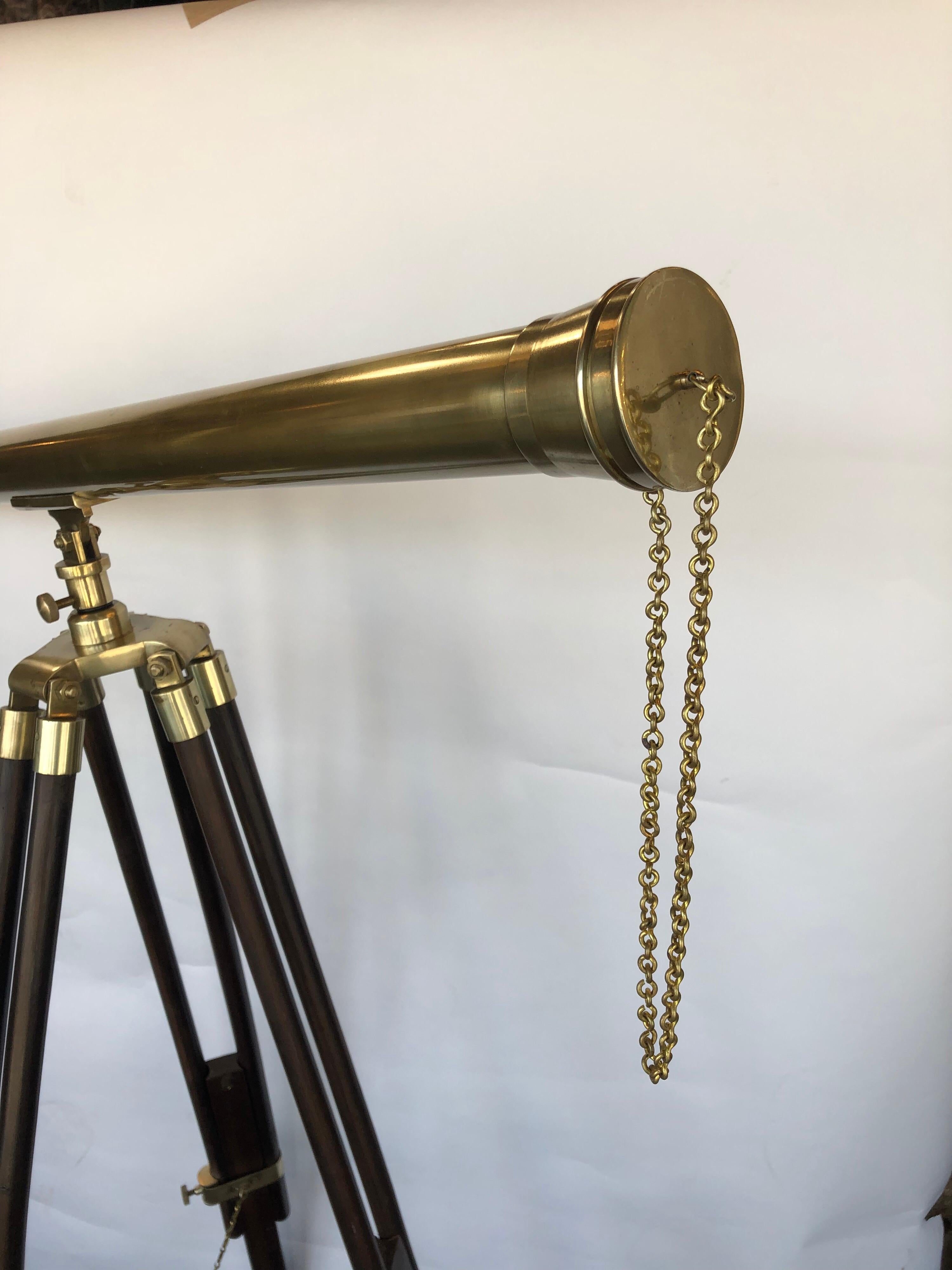 Decorative, solid brass telescope. With adjustable wooden stand.