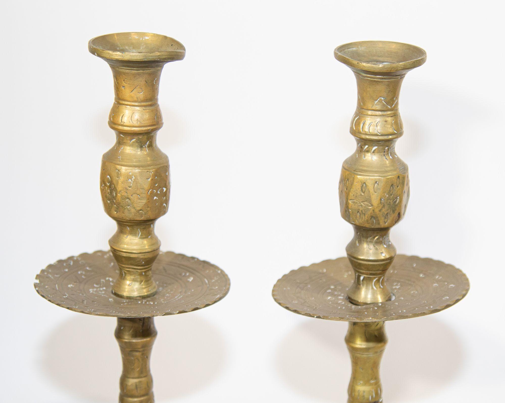 Solid brass large vintage Moroccan candle holders set of two.
Moroccan vintage brass candlestick heavy solid cast brass, handcrafted with etched geometric design.
Tall Moorish style Mid Century brass candlesticks.
These would be perfect to dress
