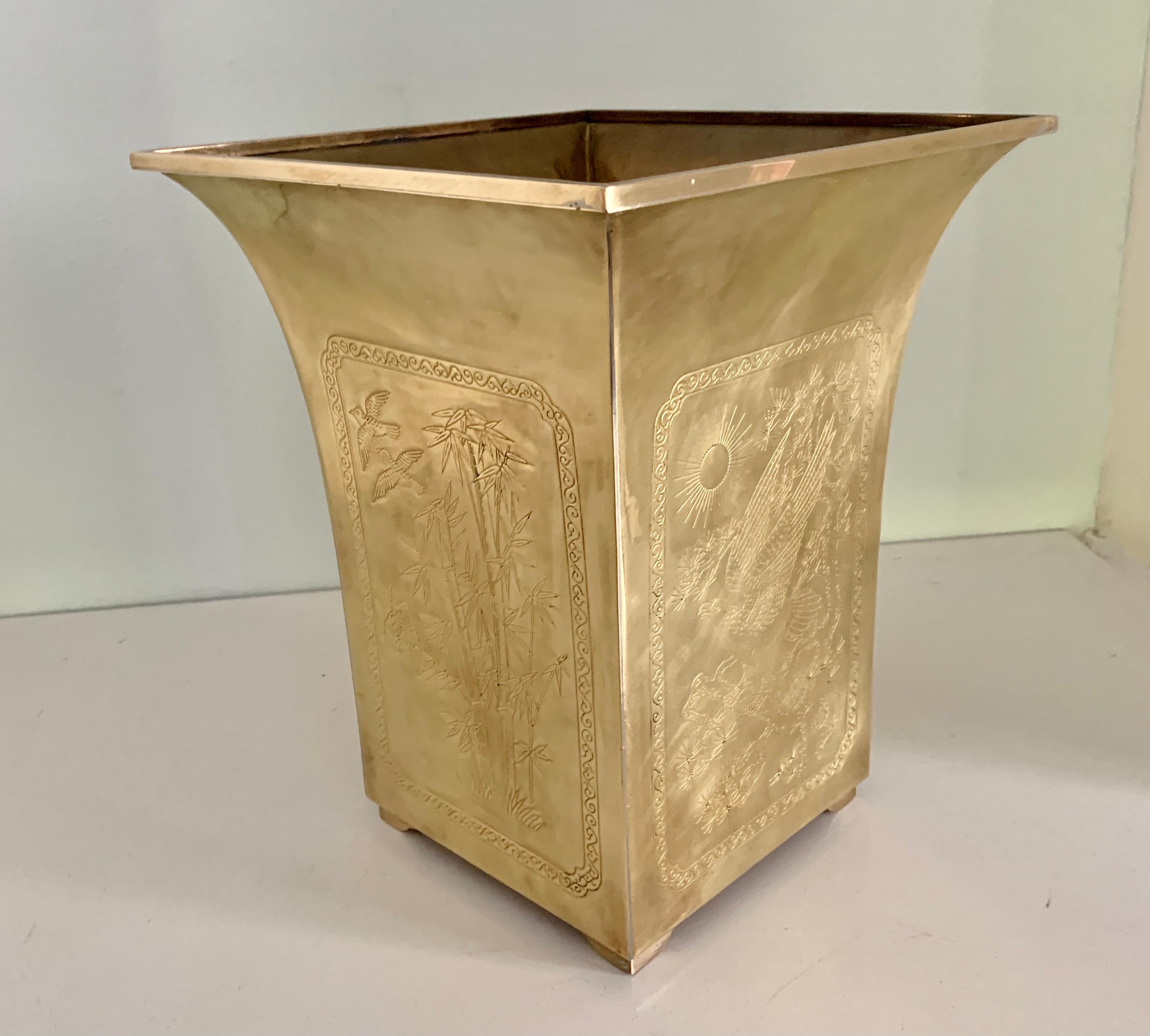 Solid brass square waste can with different Asian depictions of bamboo, birds on all four sides. The can has a graceful curve from the top to the base - very nice design to compliment any room, especially those in the office, bedroom or guest room.
