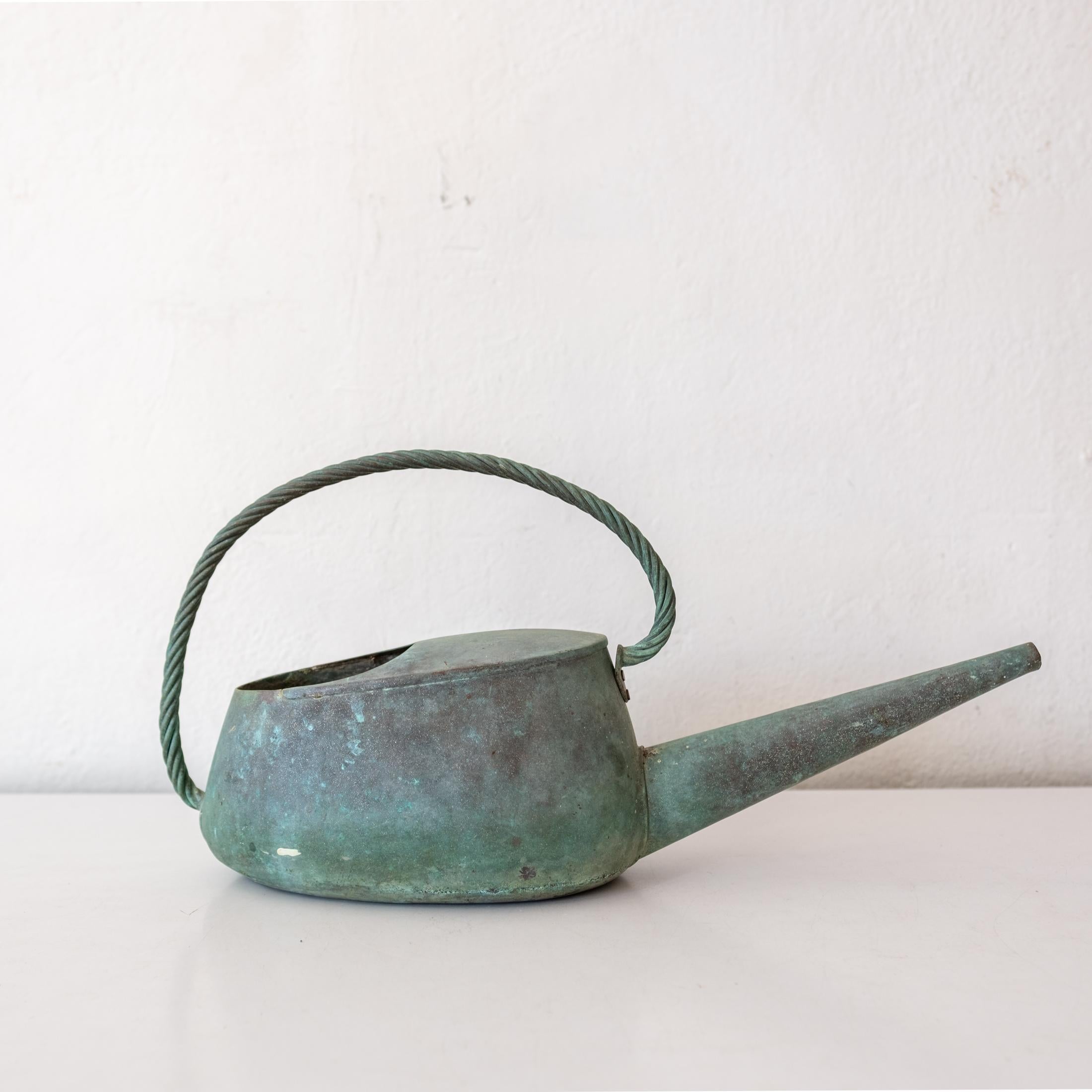 A high quality thick solid brass watering can. A functional aesthetic with a beautiful patina. Signed on the bottom. Watertight and pours nicely.